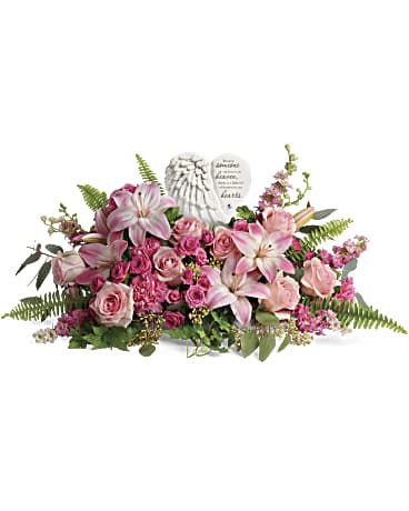 Teleflora's Heartfelt Farewell  - Say a heartfelt farewell to a loved one with this touching porcelain keepsake, nestled in a bouquet of the prettiest pink roses and lilies. This heartfelt bouquet includes pink roses, pink spray roses, pink asiatic lilies, pink carnations, pink larkspur, green ivy, seeded eucalyptus, silver dollar eucalyptus, and sword fern. Delivered with Teleflora's Heaven's Heart Keepsake. Orientation: One-Sided  SUBSTITUTION POLICY – Always deliver the freshest flowers! Please note the bouquet pictured reflects our original design.  If the exact flowers or container in this arrangement are not available, our local florists will create a beautiful bouquet with the freshest available flowers.