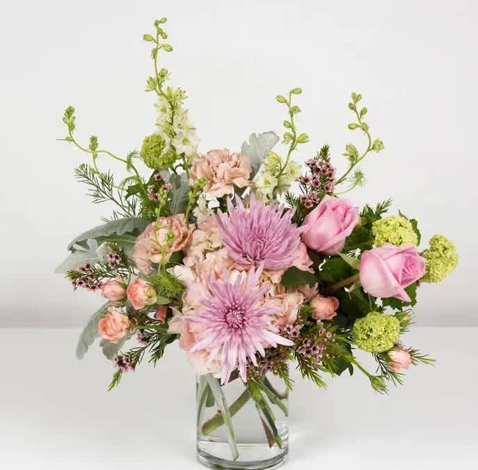 Sweet Victory - Carnations, wax flower, mini hydrangea, roses, mums and larkspur make up this beauty