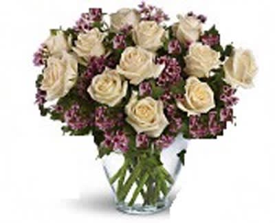 12 Roses Victorian Lovestory of Roses - As Shown: 12 White Roses arranged in a vase. Deluxe: 18 Roses arranged in a vase Premium: 24 Roses arranged in a vase  