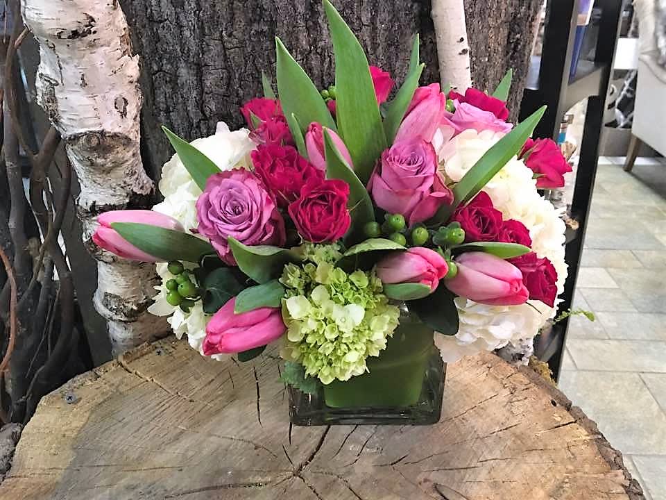 Anastasia - A beautiful stylish cube style arrangement with premium  flowers such as roses. spray roses, hydrangea and hypericum.
