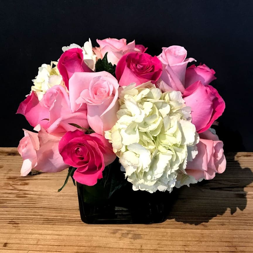 Andromeda  - This stunning piece of roses and hydrangeas in a simple vase.