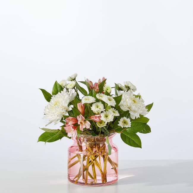 Infatuated Bouquet - This sweet bouquet will let your special someone know you're smitten! Pink alstroemeria and roses are set among white mums in a stunning pink vase.