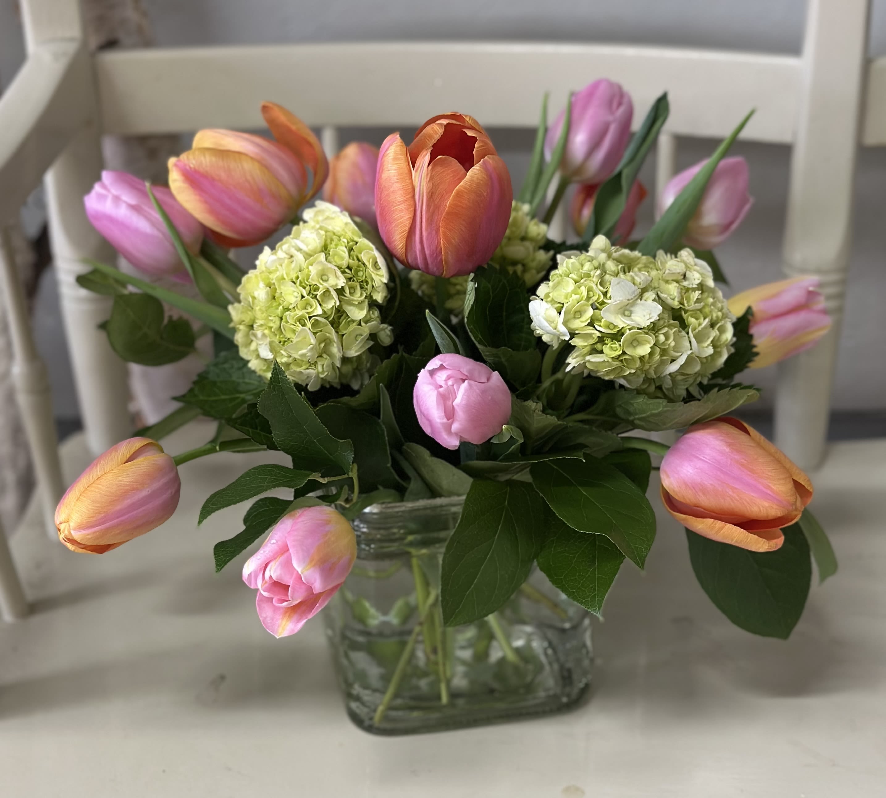 spring tulips - our own farm grown tulips arranged in a short square vase. Tulip colors may vary