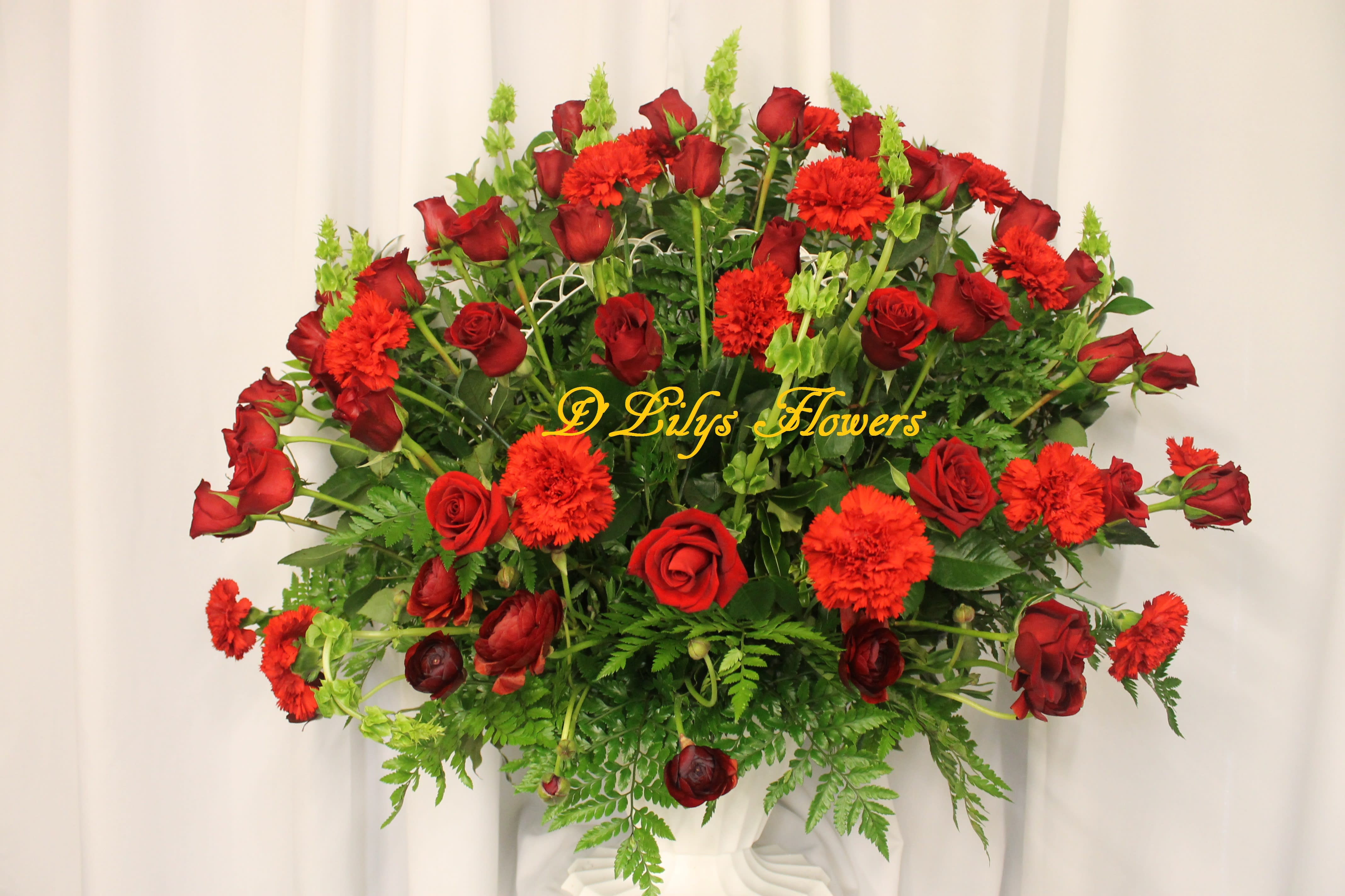 Reds - This arrangement shouts extravagant! All in beautiful reds.