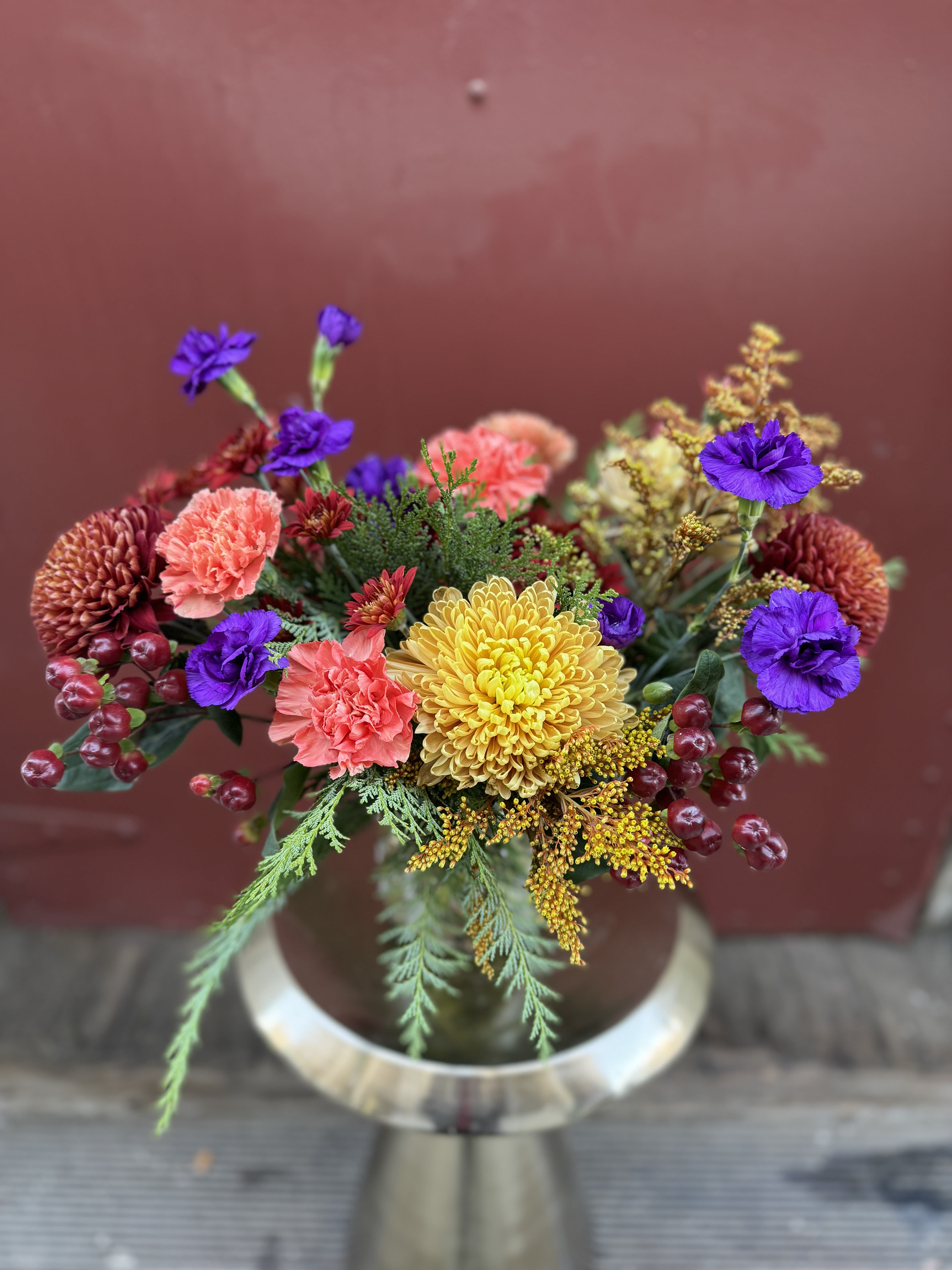 Cozy up by the fire - A fresh, long lasting floral arrangement inspired by the chill in the air and cozy glow of the fireplace. A perfect Thanksgiving centerpiece, or seasonal arrangement to remind its recipient of the changing season.
