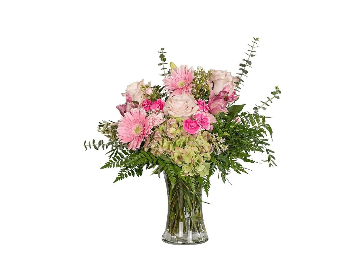 HAPPY HYDRANGEA - Happiness is a life well lived. Happy Hydrangea reminds them that you contribute to that happiness. Flowers such as hydrangeas, roses, and daisies are cheerfully arranged in this everyday beauty. Approximately 23"W X 24"H  Container may vary based upon availability.