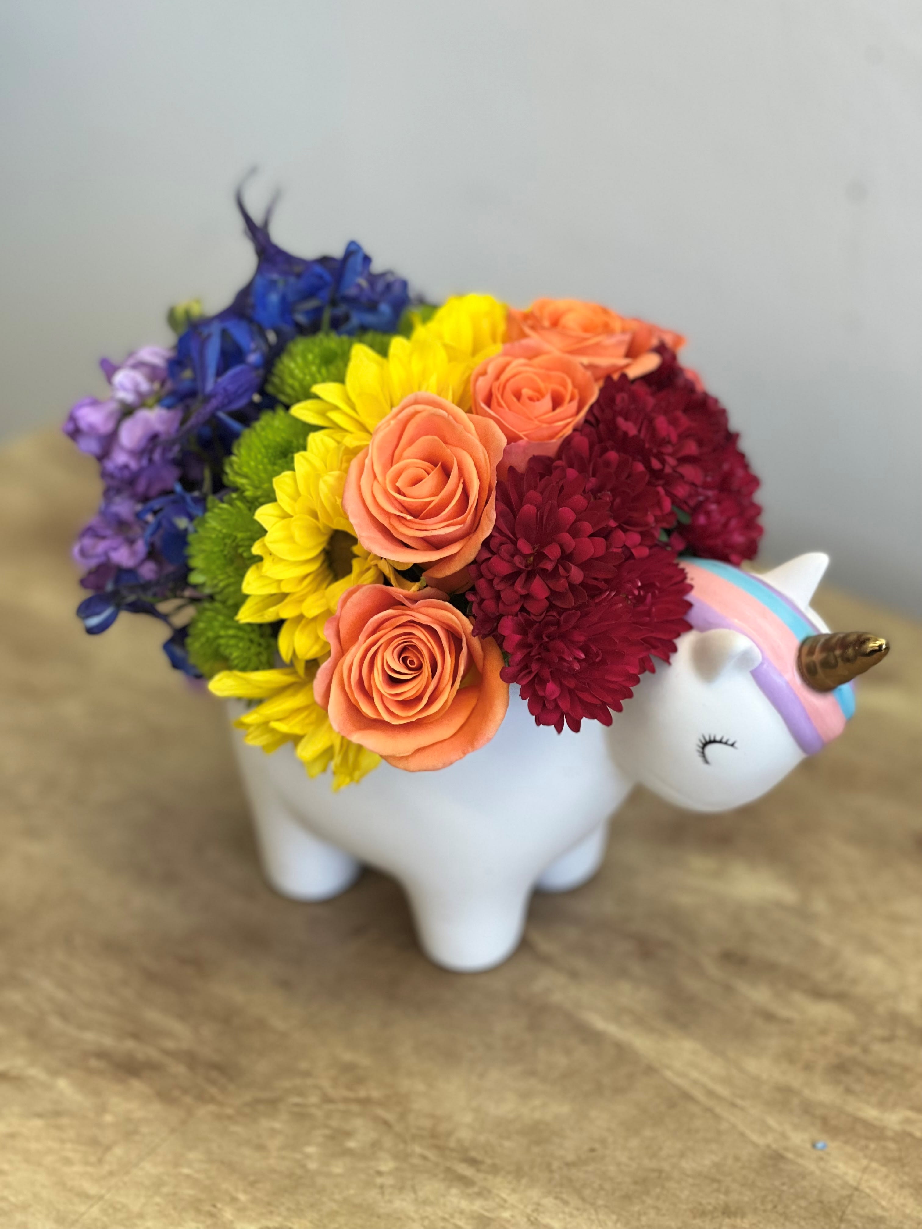 Rainbow Unicorn - A rainbow of colored flowers in this adorable Unicorn keepsake container.  