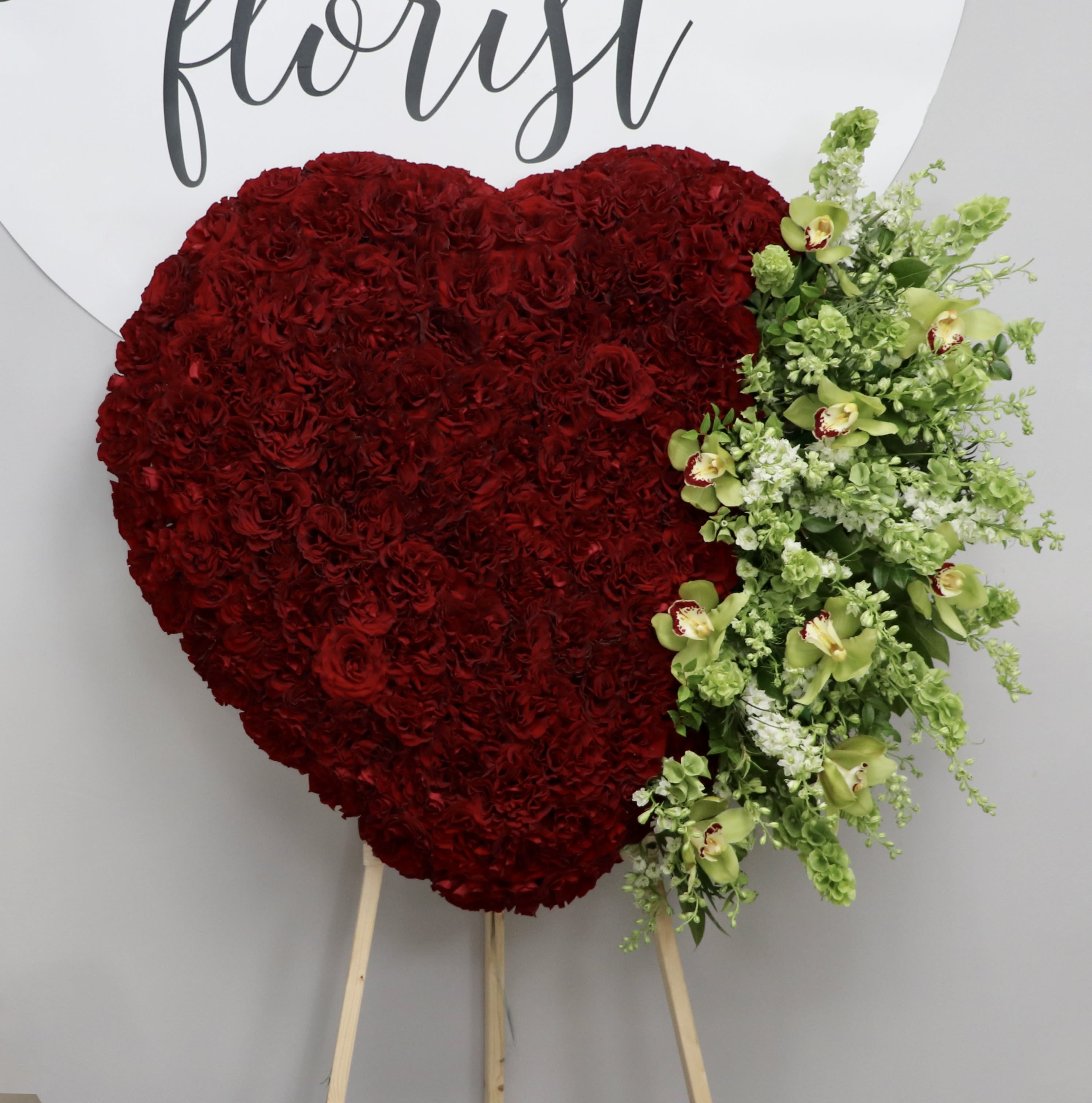 Full Red Heart  - Red Roses and Orchids is all this heart desires.     We include easel, printed banner and delivery (some fees may apply). An additional banner can be added for $15    Standard size is 30'', deluxe is 36'', and premium is 42''.