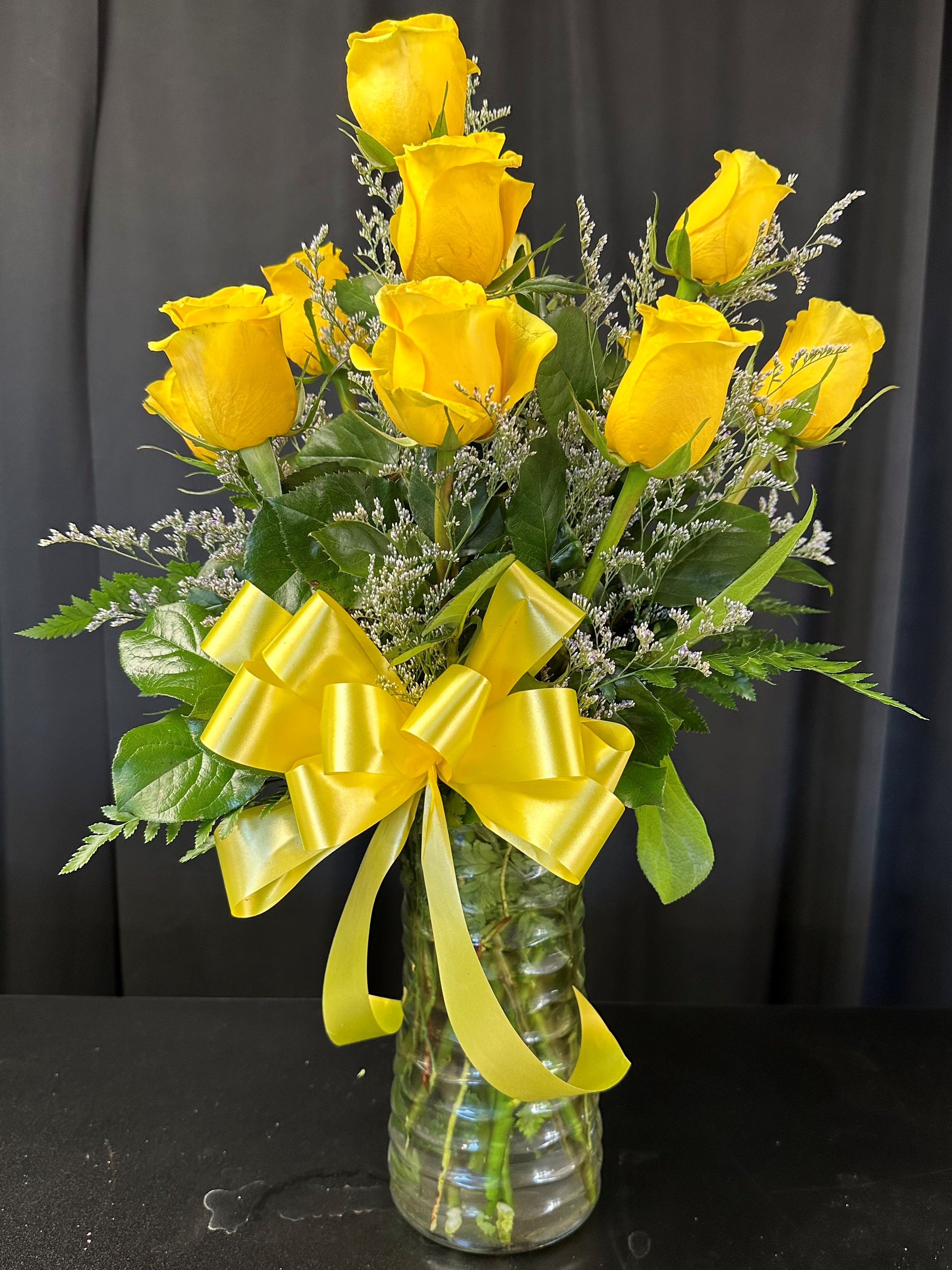 1 Dozen Yellow Roses - A dozen yellow roses, a timeless symbol of friendship and joy, each petal radiating warmth and happiness. This classic bouquet exudes elegance and grace, perfect for expressing admiration and appreciation. Whether as a romantic gesture or a token of friendship, these yellow roses convey heartfelt sentiments with their sunny disposition.