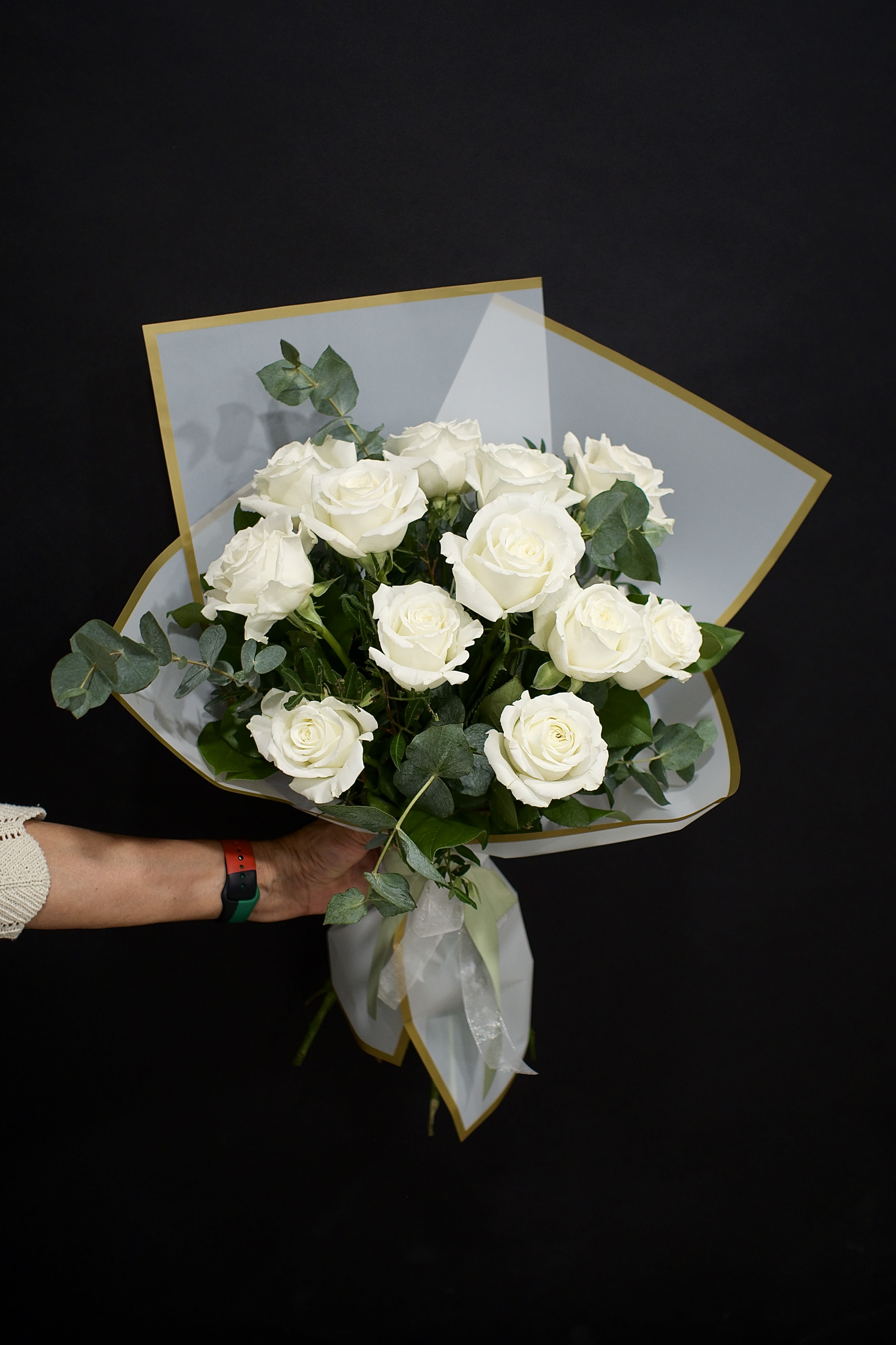 One dozen white roses - Hand tied bouquet - A bouquet of white roses weaved with tree fern, pistacia, salal,  and silver dollar eucalyptus.
