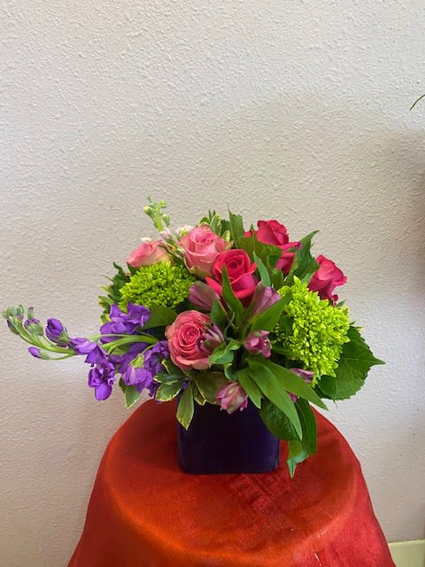 Shades Of Love by Forever Flowers - A compact and beautiful arrangement that is great for any occasion.  Contains pink roses, light pink roses, green hydrangea, and other blooms.  