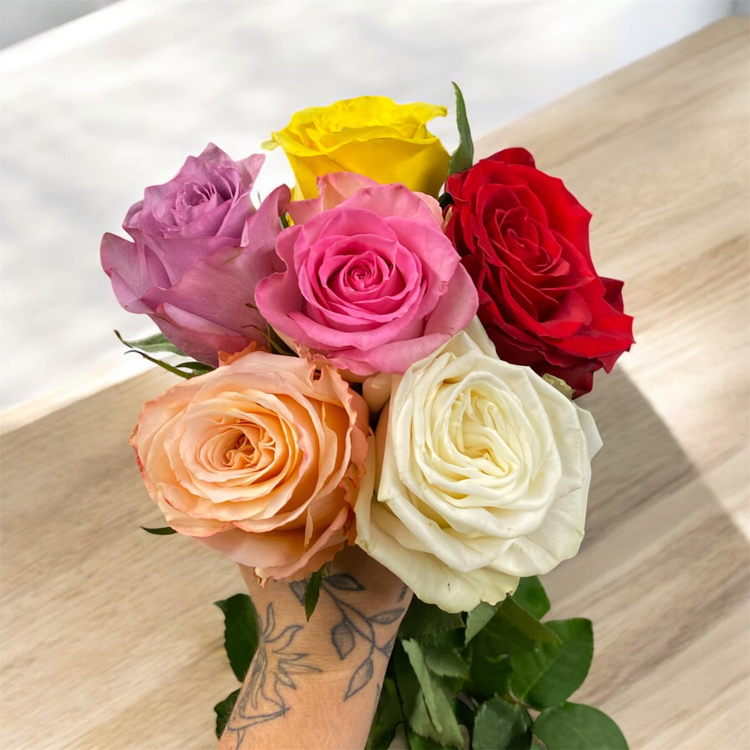 Two-Dozen Mixed Colored Rose Arrangement  - Allow our expert florists to create a gorgeous premium rose arrangement, using fresh roses available. The combination of fresh roses will be arranged and ready to enjoy.