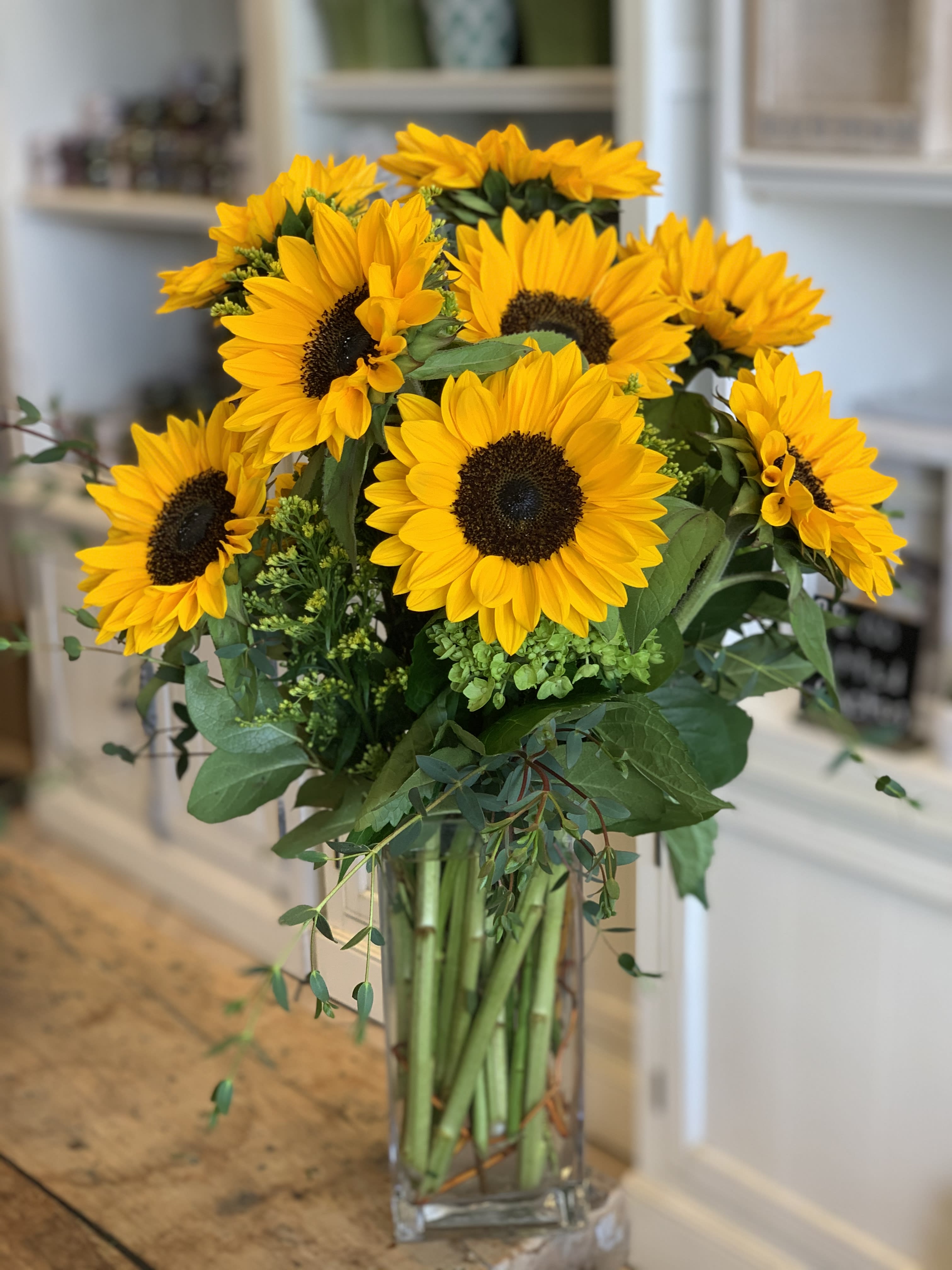 Sunflowers Sunrise - Make a bold statement with the vibrant beauty of sunflowers! Their bright, cheerful petals are sure to create a smile and brighten any room. Perfect for spreading warmth and happiness, this sunny arrangement is ideal for any occasion that calls for a burst of joy.