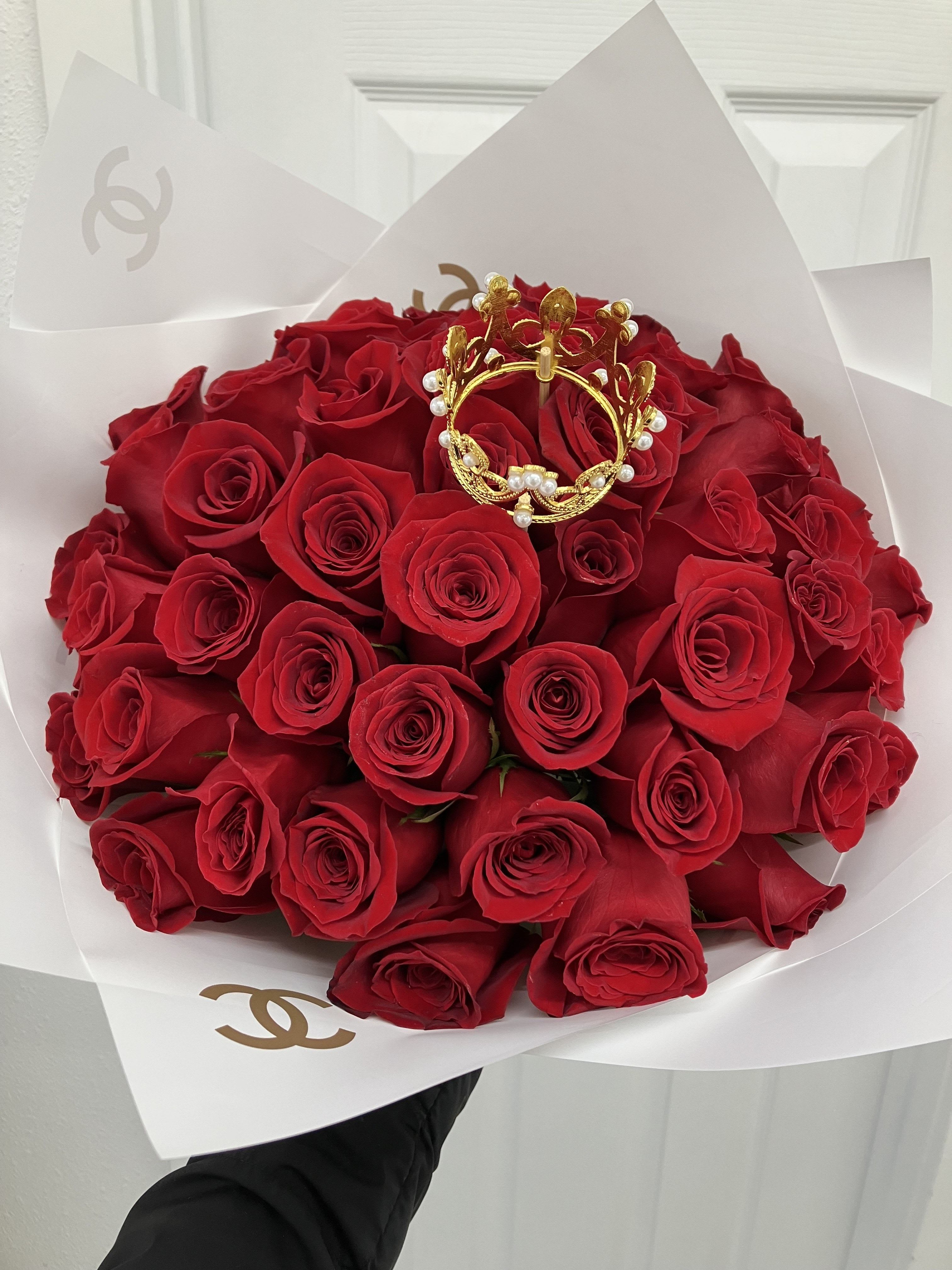 Red Ramo Buchon  - Beautiful Ramo Buchon in red of 50 roses!  If you'd like a specific color of paper please add to the notes what color you'd like! (Does not come in vase, this is a wrapped bouquet. The stems will also be wrapped in paper with  bow on the bottom) 