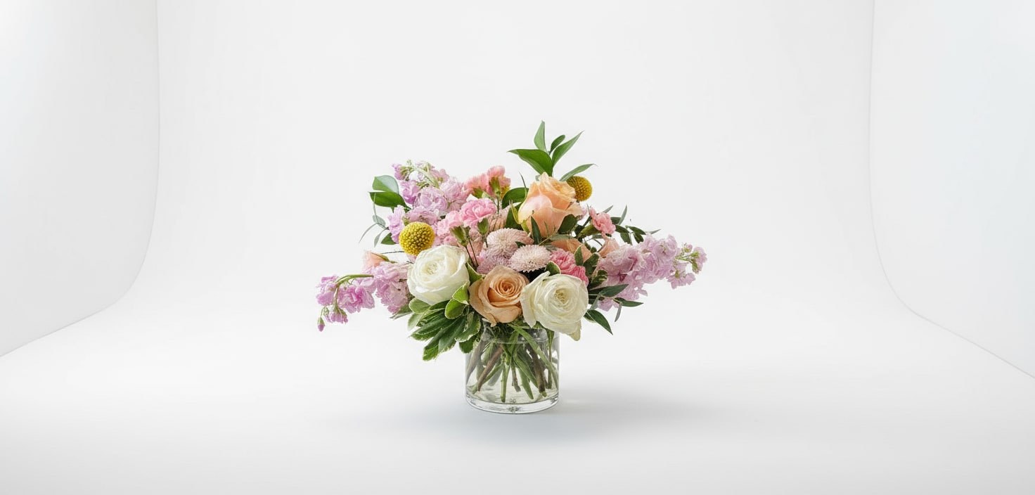French Market - This garden-style arrangement blends soft pastels to create a gift that is worthy of all occasions.