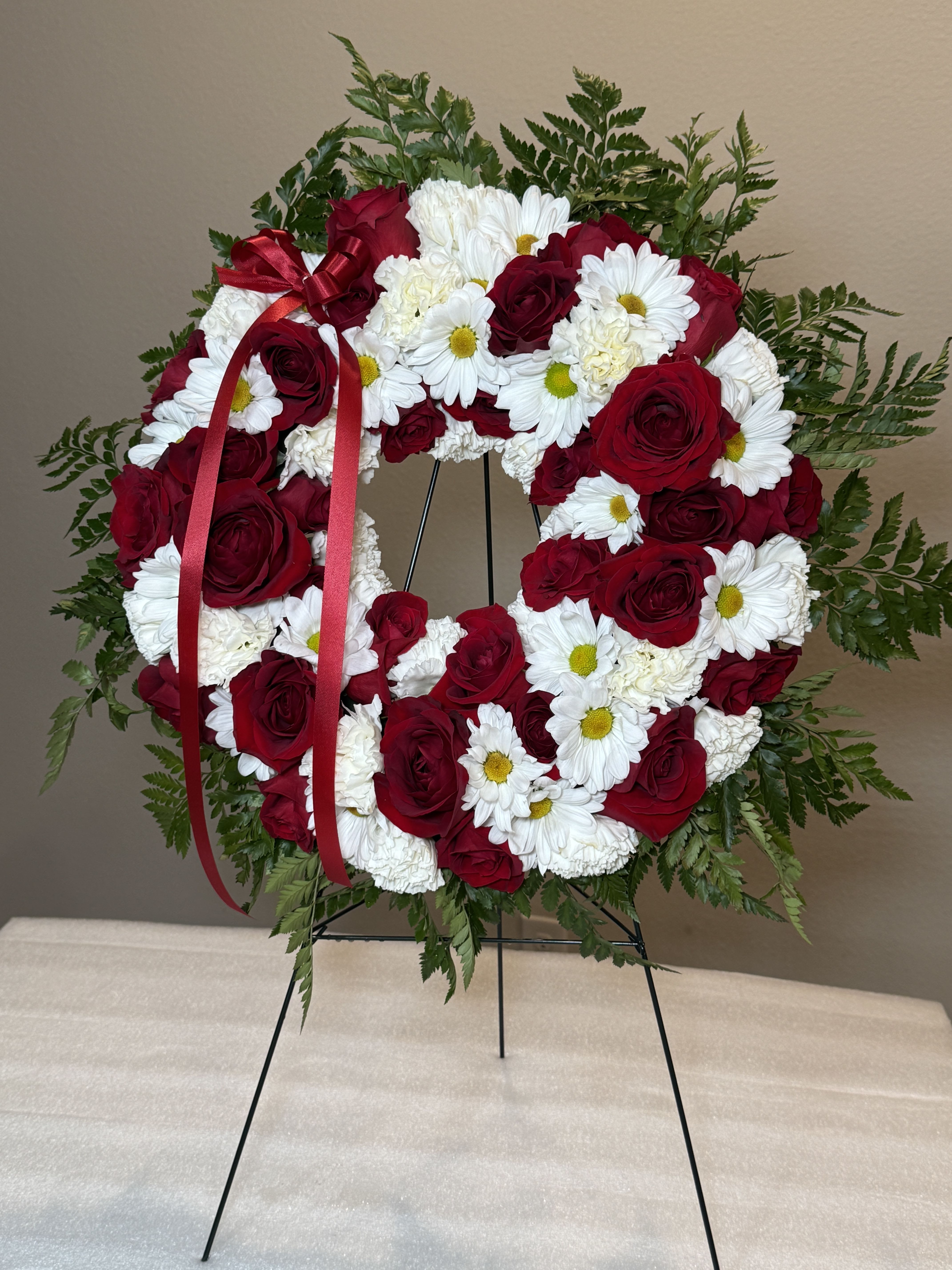 Love &amp; Remembrance - This stunning red and white wreath embodies the harmony of strength and serenity. A heartfelt expression of love, unity, and enduring commitment. Measurements are approximately 27inches tall and 21 inches wide.