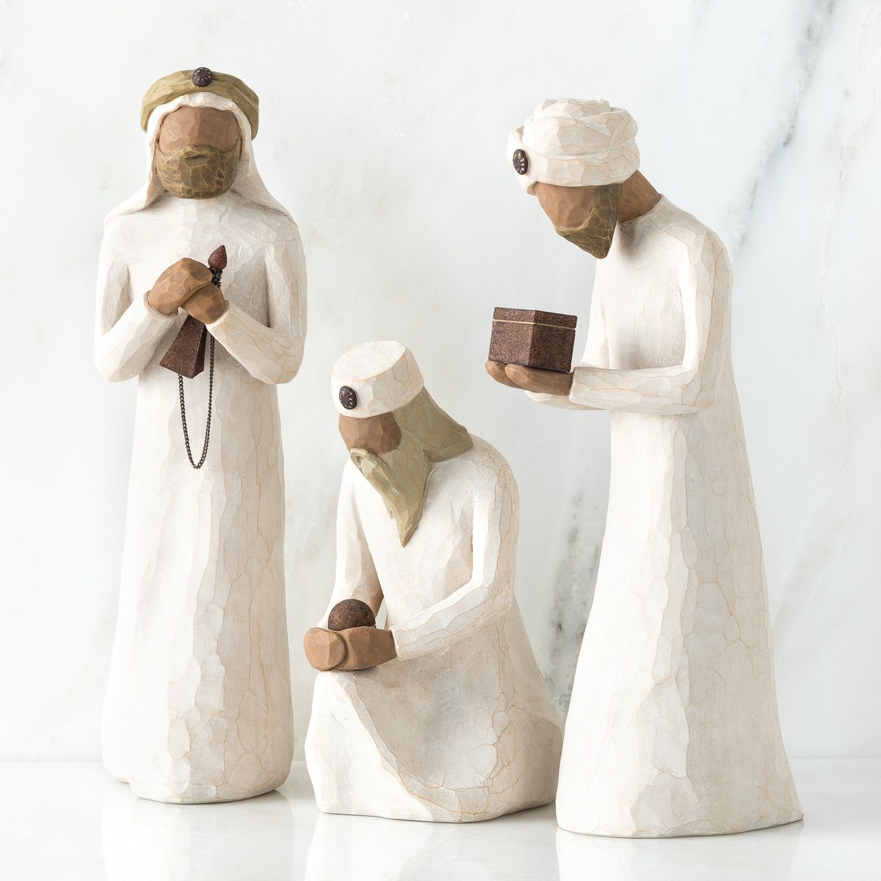 Willow Tree- The Three Wise Men - Three hand-painted resin figures, tallest is 8.5”h. Three figures (kneeling, bowing and standing) in cream garments each carrying a metal vial or box Packaging box includes enclosure card for gift-giving Dust with soft cloth or soft brush. Avoid water or cleaning solvents