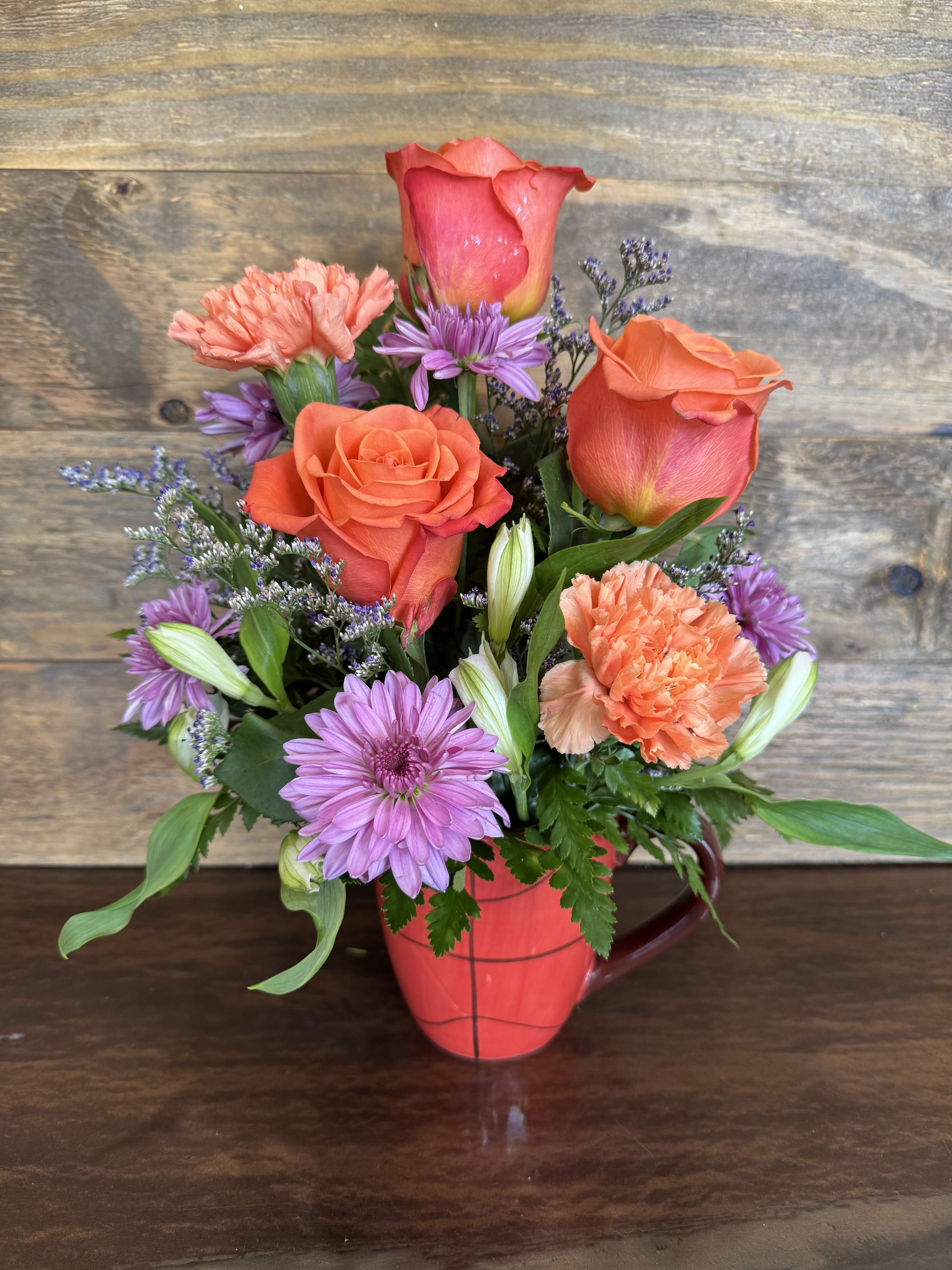 Basketball Fun  - Sports fans will love this basketball mug filled with vibrant blooms.