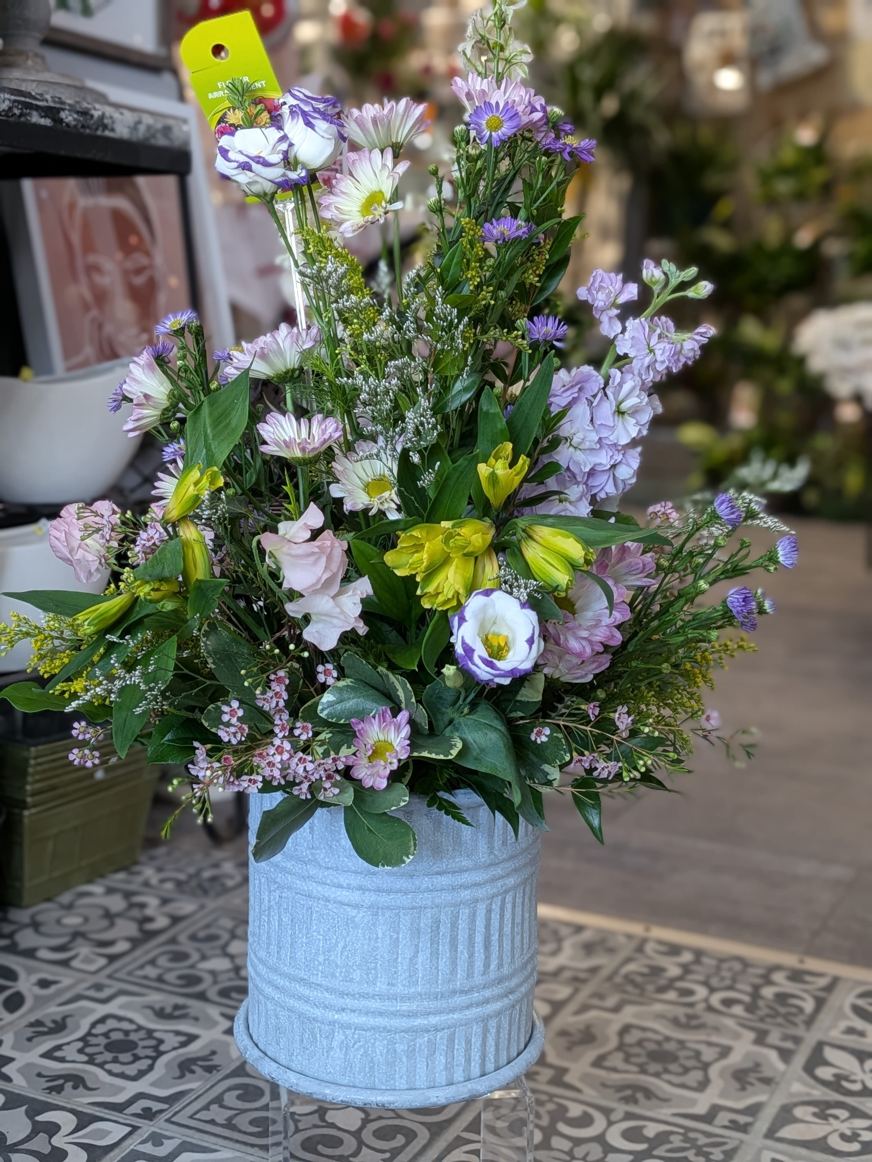 Galvanized Garden (Designers Choice) - Love grows as bright and beautiful as a garden! This is a designer choice. If there is any preference on flowers please write in special instructions or call the shop to place your order. 27Hx17W All Around