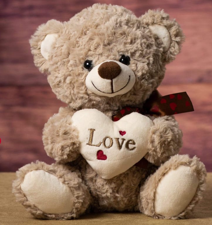 9" Valentine Bear - 9" light tan stuffed bear, soft and cuddly in design, holding a plush cream-colored heart embroidered with the word "Love."  Perfect for expressing love and affection, this adorable bear makes a sweet gift for any special occasion.