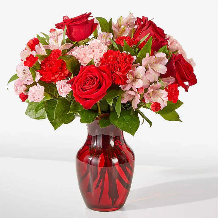 Lady in Red - Red roses, red and pink carnations make it a special occasion. 