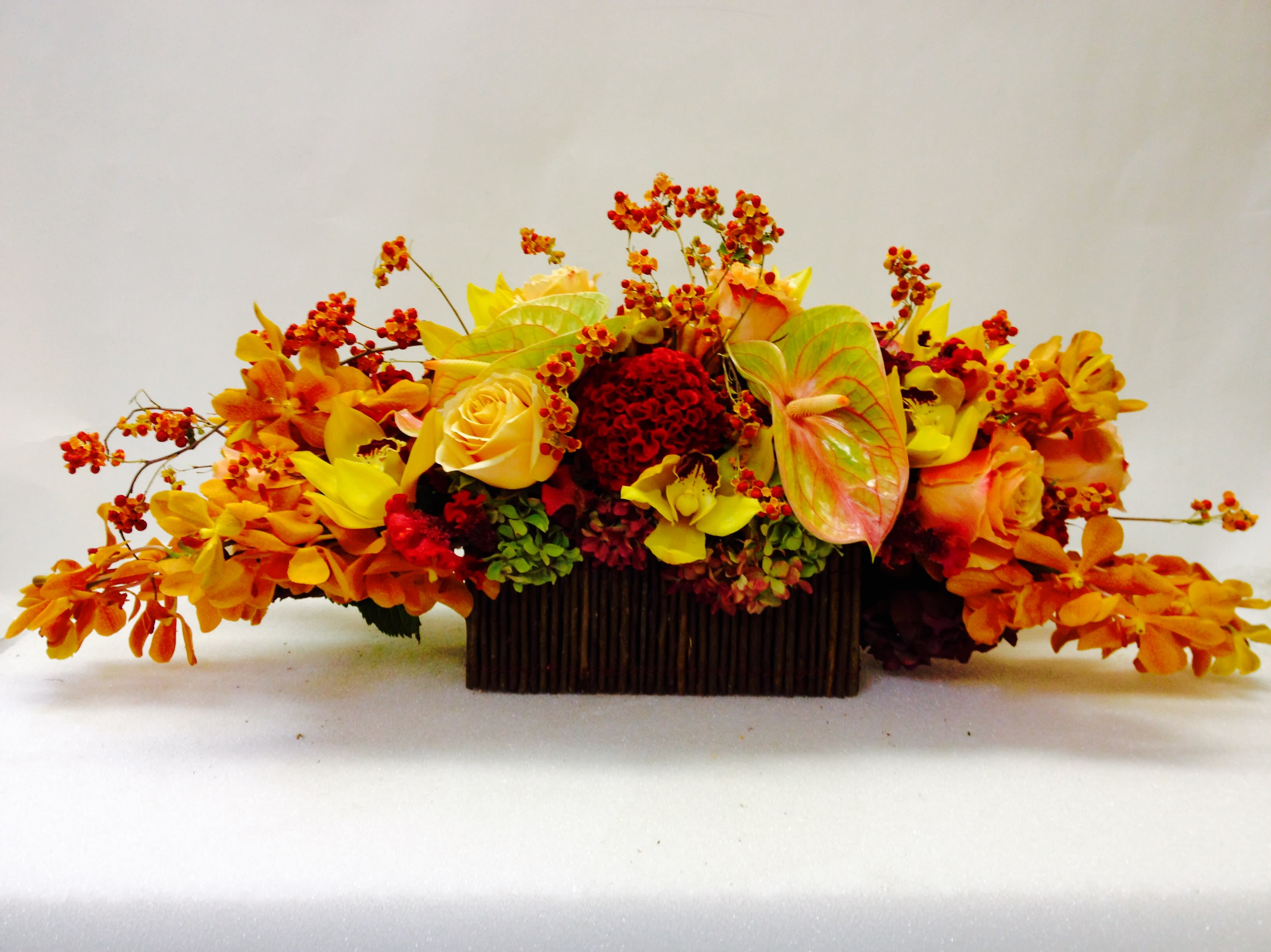 SOME KIND OF BEAUTIFUL - The Harvest Centerpiece: Thanksgiving Flower Delivery San Francisco Elevate your holiday table with this gorgeous centerpiece from Jane's Roses! Featuring a luxurious mix of red, orange, and yellow flowers, this design is the perfect focal point for your Thanksgiving table or autumn celebration.  Order flowers online now to secure this rich, seasonal display.  Warm Autumn Hues: A stunning mix designed for the season, including vibrant roses, exotic orchids, and rich seasonal textures (as pictured), all in warm, inviting colors.  Ready-Made Centerpiece: Designed at the ideal height and fullness for comfortable table conversation.  Perfect for Gifting: A beautiful way to thank your host or brighten your own home.  Trust your local San Francisco florist for fresh, reliable holiday service.  Same-Day Flower Delivery SF is available! Buy online before 1:00 PM for fast flower delivery in San Francisco before the holiday rush. Shop our Thanksgiving collection today!