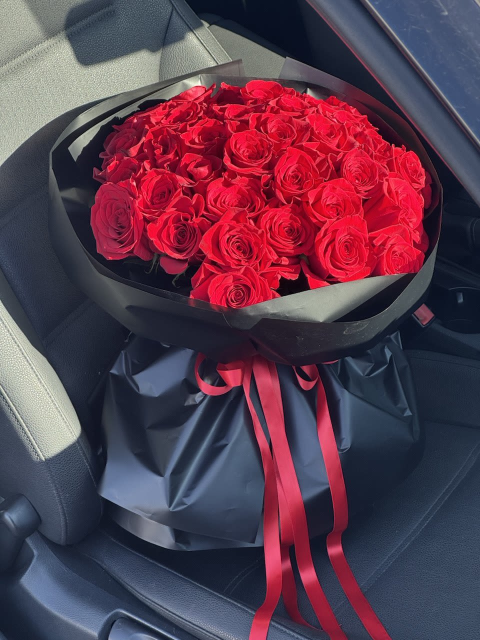 A Bouquet of Red Roses — The Language of Passion and Eternal Love - The red rose has always been, and will forever remain, a symbol of deep affection, sincerity, and everlasting devotion. Each delicate petal carries a story of love, while every bloom holds a promise of loyalty and warmth. This is why a bouquet of red roses is considered a timeless classic and one of the most desired gifts across generations.  When you give red roses, you speak without words. They convey the purest of emotions: from a heartfelt declaration of love to gratitude for years spent together. A bouquet of red roses can mark the beginning of a romantic journey on a first date, symbolize passion and unity on a wedding day, or serve as a sign of respect and endless commitment on an anniversary.  Red roses are both universal and unique. Some choose a mono-bouquet of dozens of crimson blooms, where each flower feels like a personal confession. Others prefer an arrangement enhanced with greenery or delicate accents to highlight the richness of shades and textures. In any form, red roses always embody a celebration of feelings and harmony. 