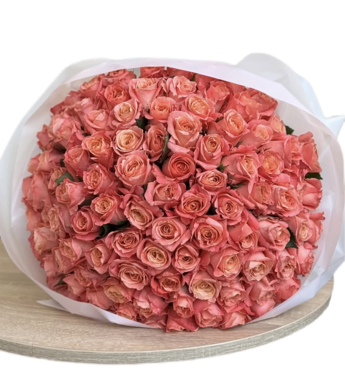 Bouquet of orange autumn roses in white packaging - 50 pieces -  magnificent bouquet of 50 orange autumn roses, carefully arranged in elegant white packaging, is the perfect embodiment of warmth, passion, and seasonal charm. Each rose blooms with vibrant shades of orange — from deep sunset tones to soft amber highlights — creating a composition that feels both luxurious and full of life.  The crisp white wrapping serves as a graceful contrast, highlighting the brightness of the petals and adding a touch of sophistication. This bouquet is not only a floral arrangement but also a statement of beauty and abundance.  Symbolizing admiration, energy, and heartfelt emotions, orange roses are a wonderful choice for celebrating milestones, expressing gratitude, or simply bringing joy to someone special. The generous number of stems makes the bouquet look rich and impressive, turning it into a centerpiece that will draw attention in any setting.  Perfect for autumn weddings, anniversaries, or as a meaningful gift during the season of golden leaves, this bouquet captures the essence of fall and transforms it into a radiant floral masterpiece. 