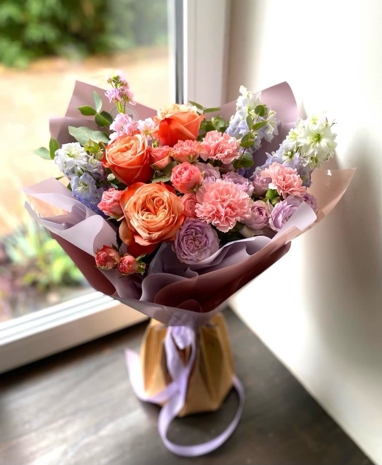 Designers choice wrapped bouquet with premium blooms - Designers choice beautifully wrapped bouquet with premium blooms 