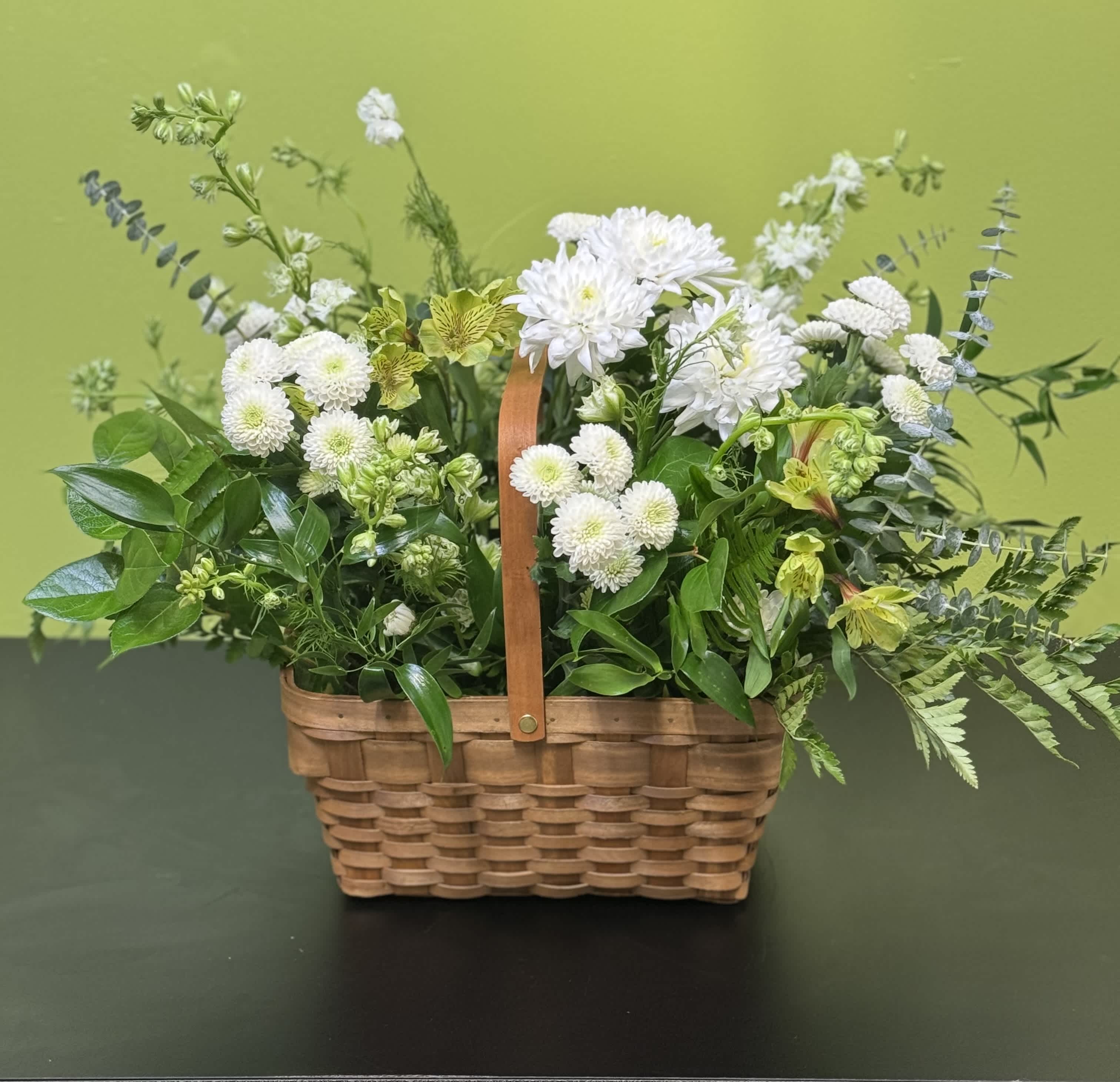Pristine by BloomNation™ - A peaceful white and green basket featuring white daisy mums and white roses with greenery in a basket. Send your sympathies to the home with Pristine by BloomNation™  