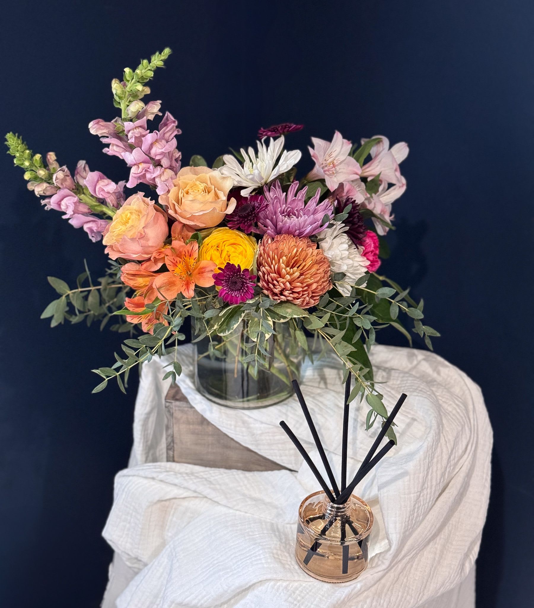 Calm &amp; Comfort Diffuser Gift Set - A thoughtful gift designed to bring a sense of calm, warmth, and ease into any space. The Calm &amp; Comfort Diffuser Gift Set is perfect for moments when flowers alone aren’t quite right, or when you want to pair something lasting with a meaningful gesture.  This curated set features a beautifully scented diffuser chosen for its soft, welcoming fragrance that gently fills a room without being overpowering or safety issues with little ones running around. Ideal for thank you gifts, sympathy gestures, housewarmings, teacher appreciation, or everyday self-care, this gift offers comfort in a quiet, intentional way.  Thoughtfully selected by The Artisan Fox, a boutique florist and gift studio in Ada, Michigan, this diffuser gift set is designed to feel personal, polished, and easy to give.  A simple way to say thinking of you, thank you, or take a moment to breathe  *Please note that our floral and color palette changes from week to week. All substitutions are equal in value.