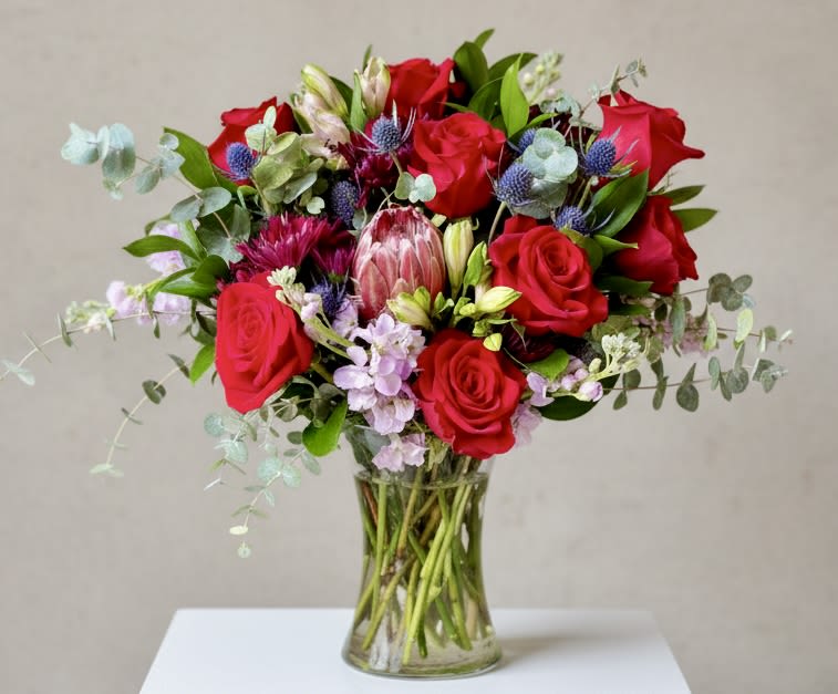 Love Bomb  - Large Arrangement of red roses, thistle, lavender stock, flowing baby blue eucalyptus.