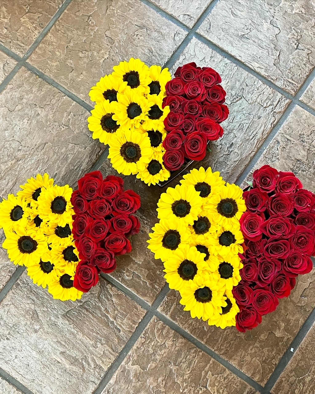 red and sunflowers heart box - Red roses and sunflowers are arranged in a heart box
