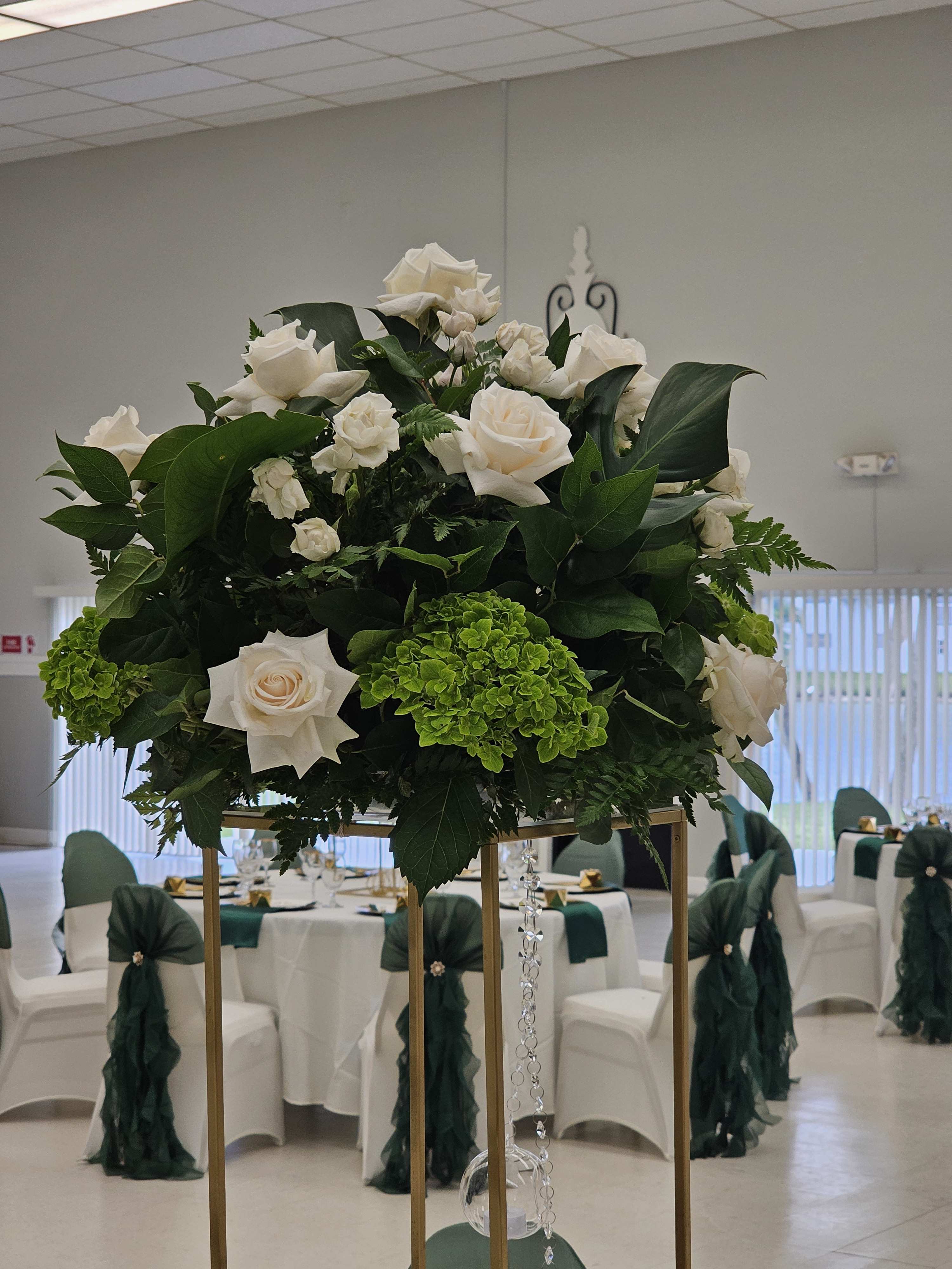 Centerpieces - These centerpieces are perfect for weddings, birthdays, corporate events etc. They can be made with the colors of your choice. They include roses, hydrangeas, filler flowers and greenery in a lomey dish. If you would prefer other types of flowers, please give us a call to place a custom order.   Vases are not included. They can be rented at an additional cost