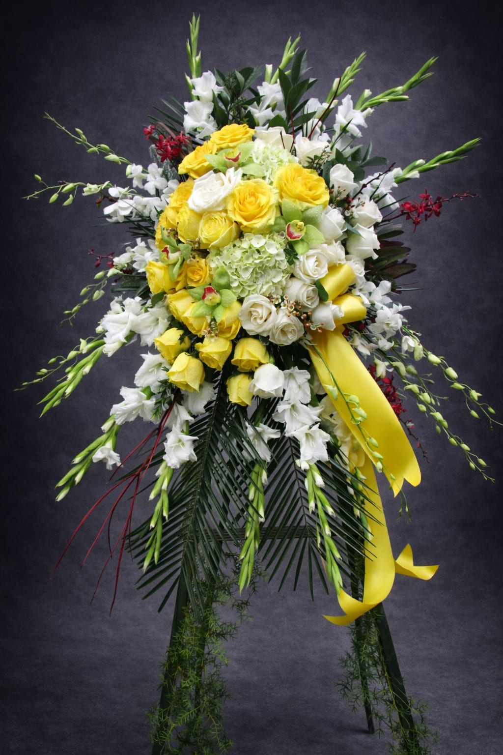 Grace &amp; Love - Share your feelings with this bountiful, full standing spray of sympathy flowers.