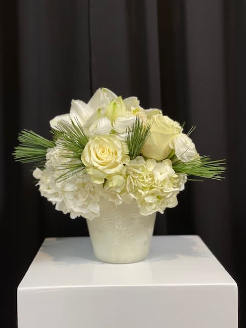Alice - This white winter mix of texture flowers and green foliage will be sure to warm up anyones day! 