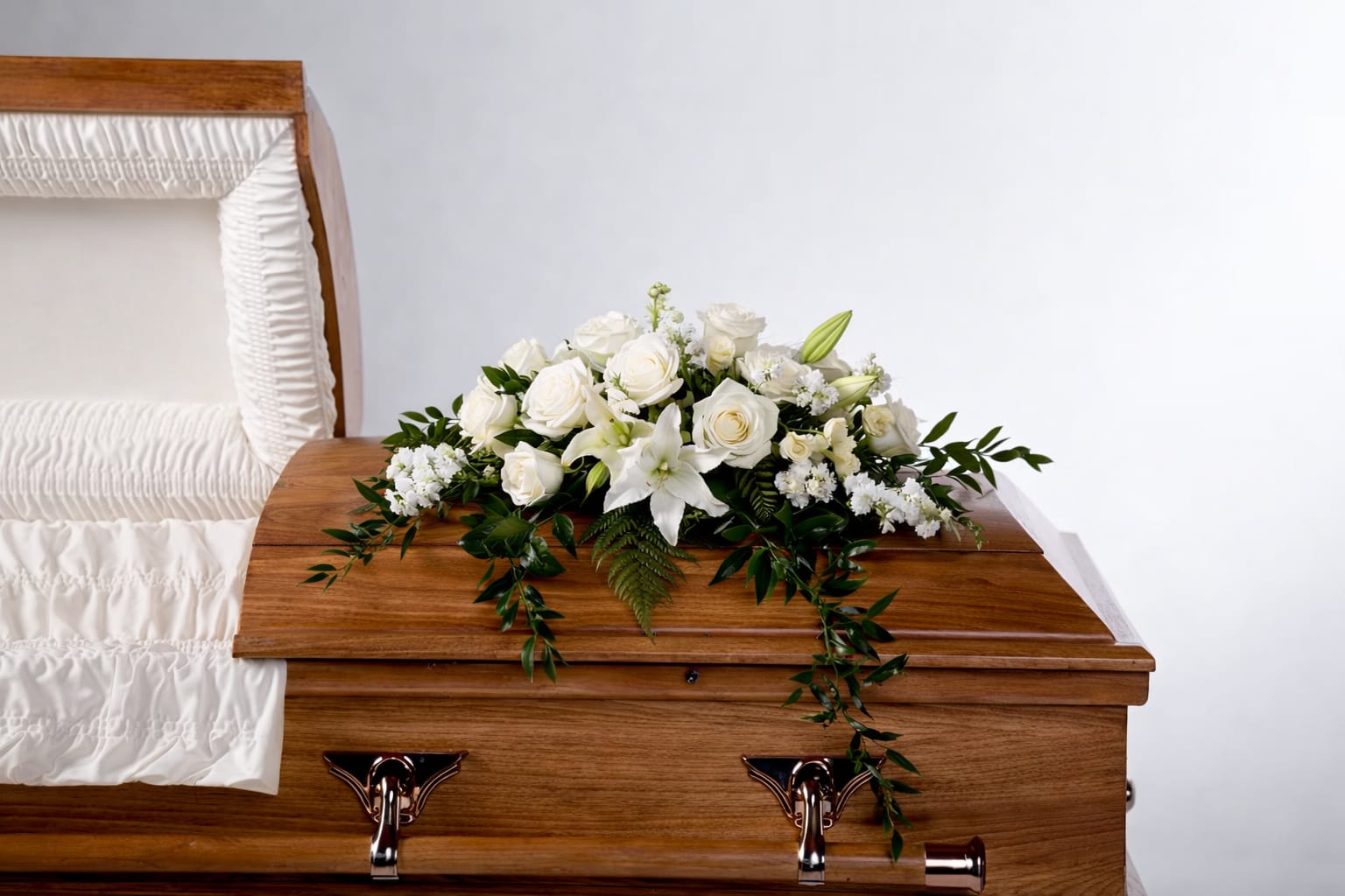 Peace by BloomNation™  - An all white tribute, this half casket spray is pure in color and heart. Featuring a variety of white flowers and greenery, this elegant half casket spray compliments the beauty of life. 