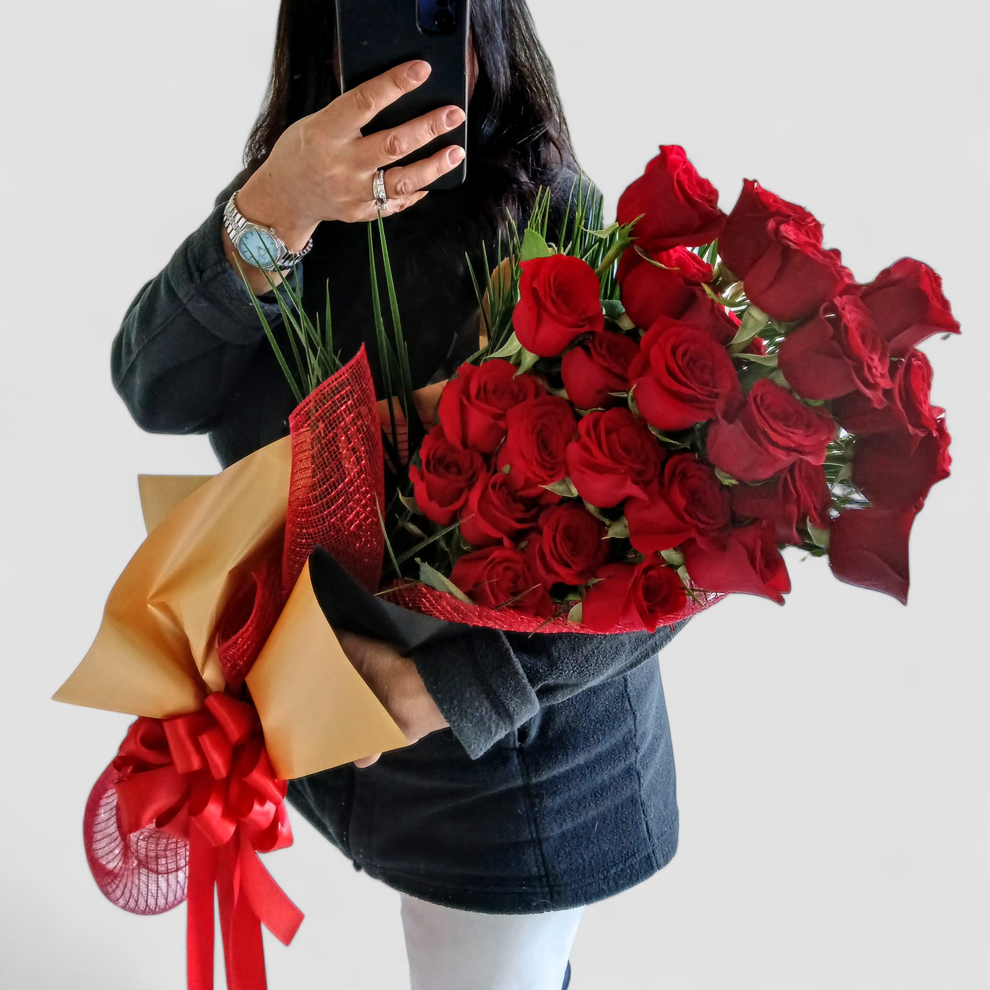 2 Dozen Red Roses Wrapped - Please call first for availability. Please allow 24 hours notice. Beautiful 2 dozen long stemmed red roses wrapped in red mesh wrap with black and gold paper adorned with a long flowing red satin bow. Send her your love.