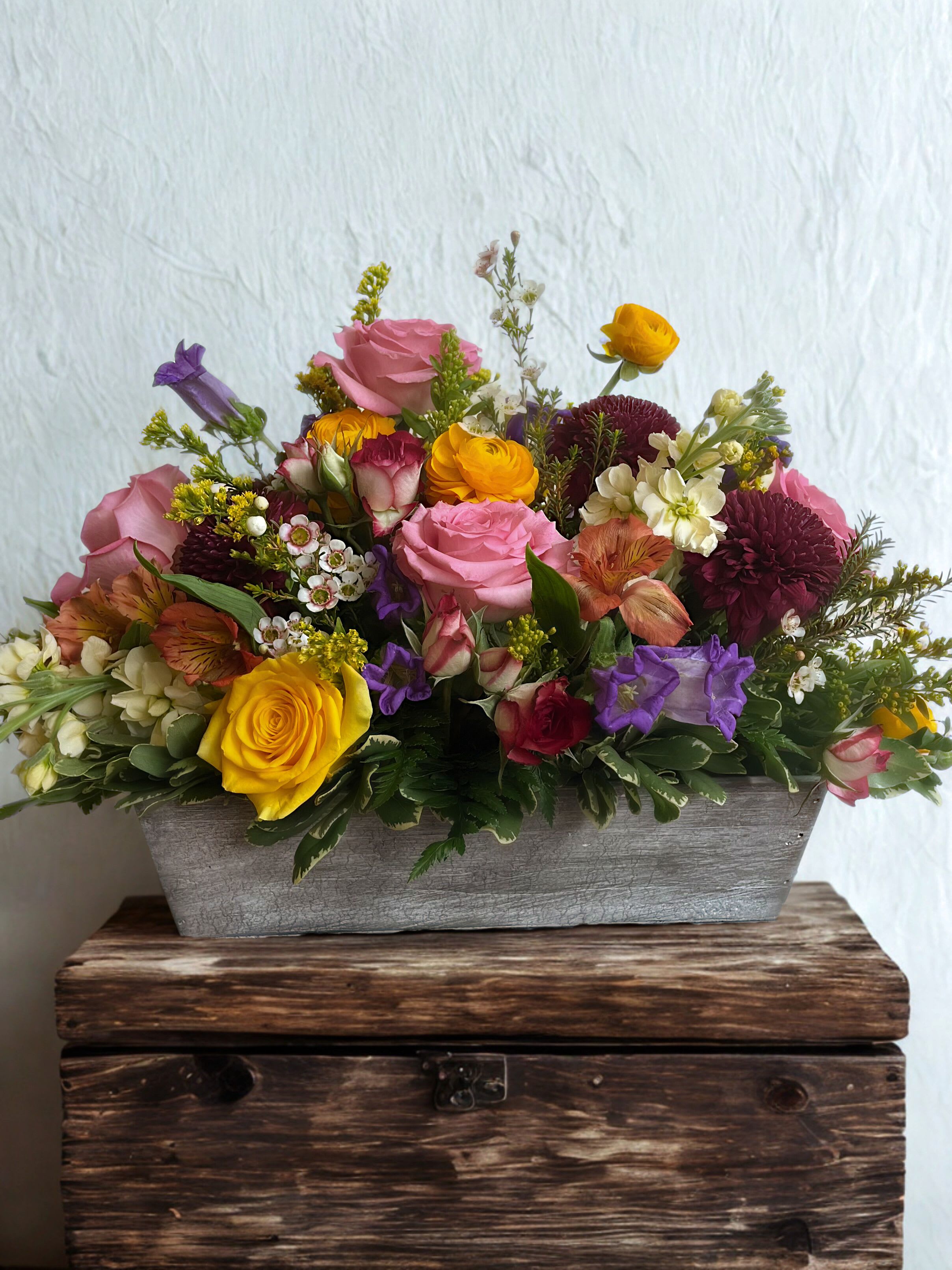 Sabrina - A joyful burst of color, "Sabrina" is designed to lift spirits and light up any room. Overflowing with vibrant, hand selected blooms in cheerful hues, this charming arrangement is beautifully styled in a classic basket for a fresh, garden-picked look. Perfect for birthdays, celebrations, thank-yous. or just because, it's a radiant way to share happiness and make any moment feel special.