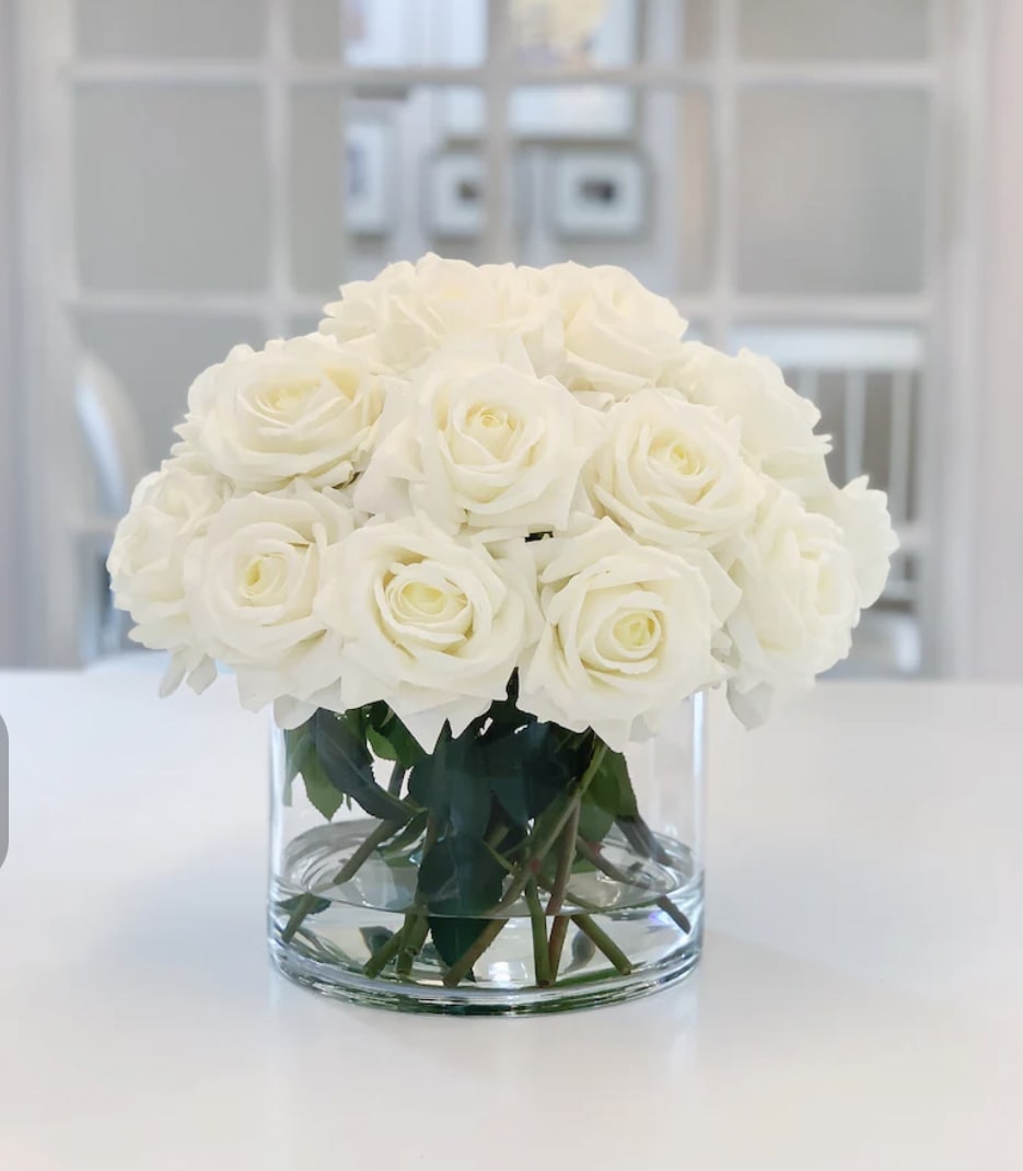 Blanca  - 24  stems of white roses placed in a clear vase .if you prefer a different color contact us .