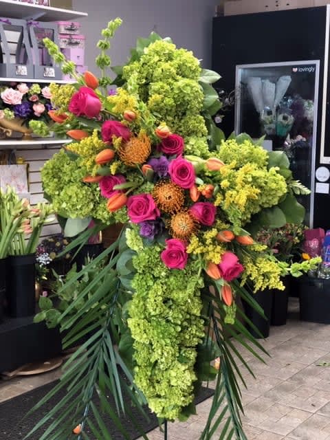 Garden Path Cross - Green cross with mini green hydrangeas with hot pink roses ,lilies, tropical pin cushions,    