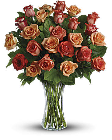 Sunrise Splendor - The sun will come out tomorrow, and tomorrow, and tomorrow with this blazing bouquet of orange roses. Orange, light orange and dark orange - gorgeous roses delivered in a sparkling flared glass vase. No doubt about it, this is one hot gift.