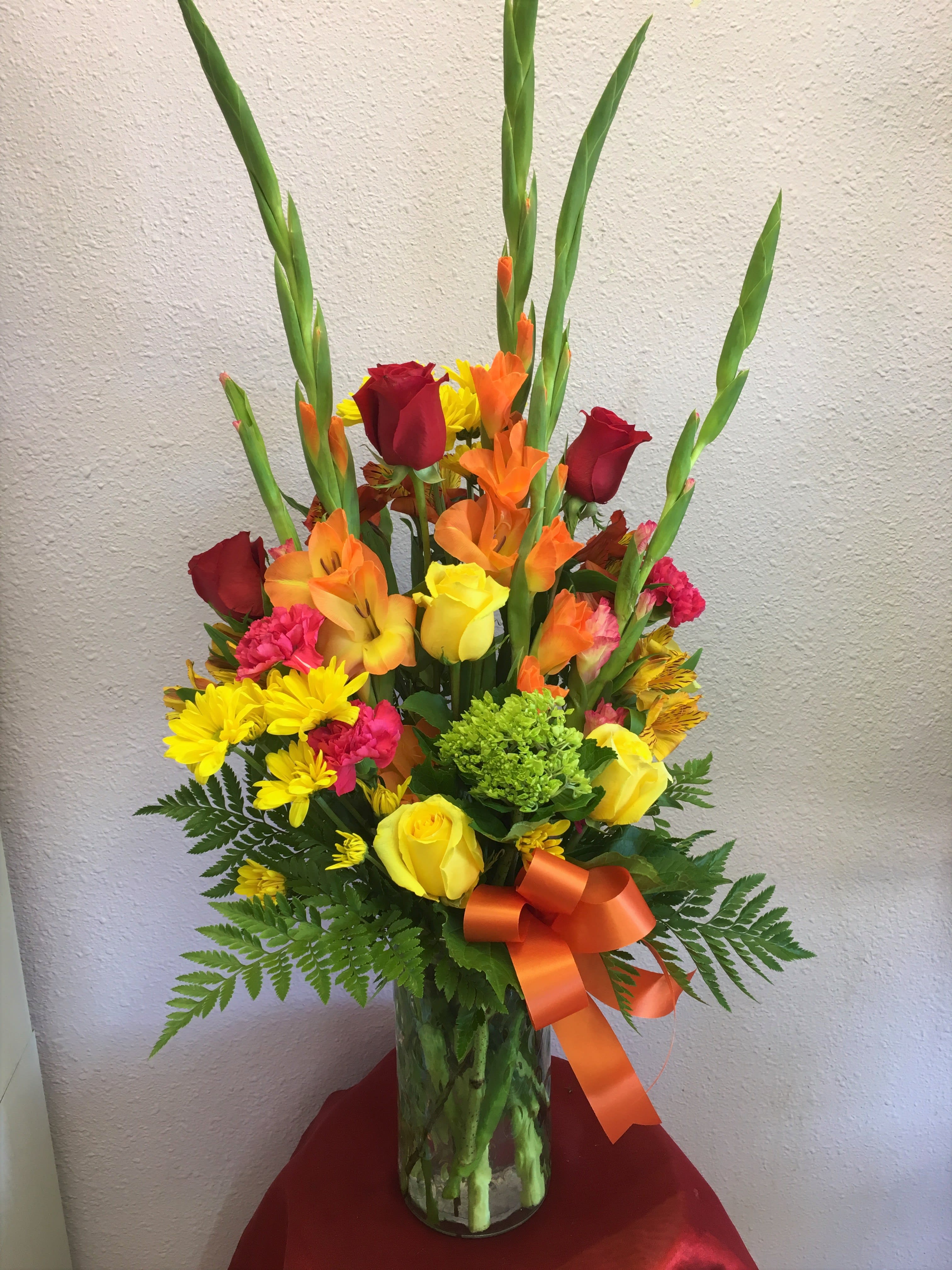 Happy Day by Forever Flowers  - A big and bright arrangement filled with colorful blooms like roses, gerberas, gladiolas, and more. 