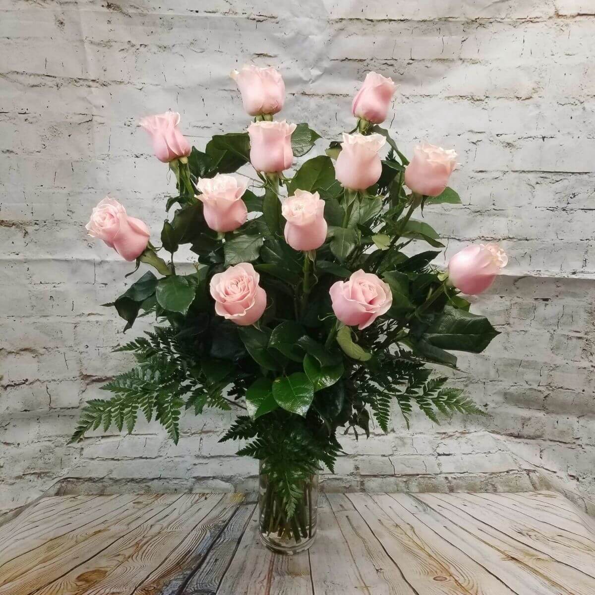 Dozen Long Stemmed Pink Roses by BloomNation™ - These pink roses are cheerful and fun! Dozen Long Stemmed Pink Roses by BloomNation™ is the perfect gift to show your love and appreciation.   APPROXIMATE DIMENSIONS: 25" H X 18" W  