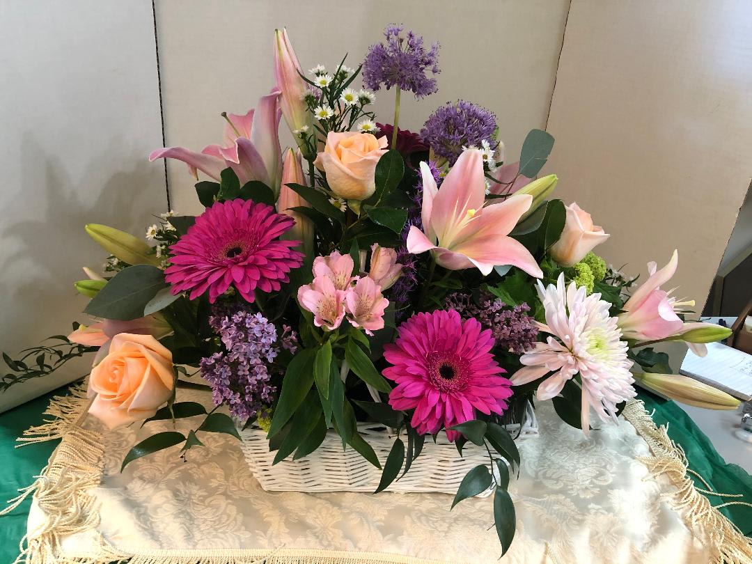 FLOWER BASKET  ( Picture is a Deluxe Basket ) - Assortment of High End Quality  Flowers.  Colors and assortment will be determined by the occasion.  Some Flowers are Seasonal.   Any Questions please call.