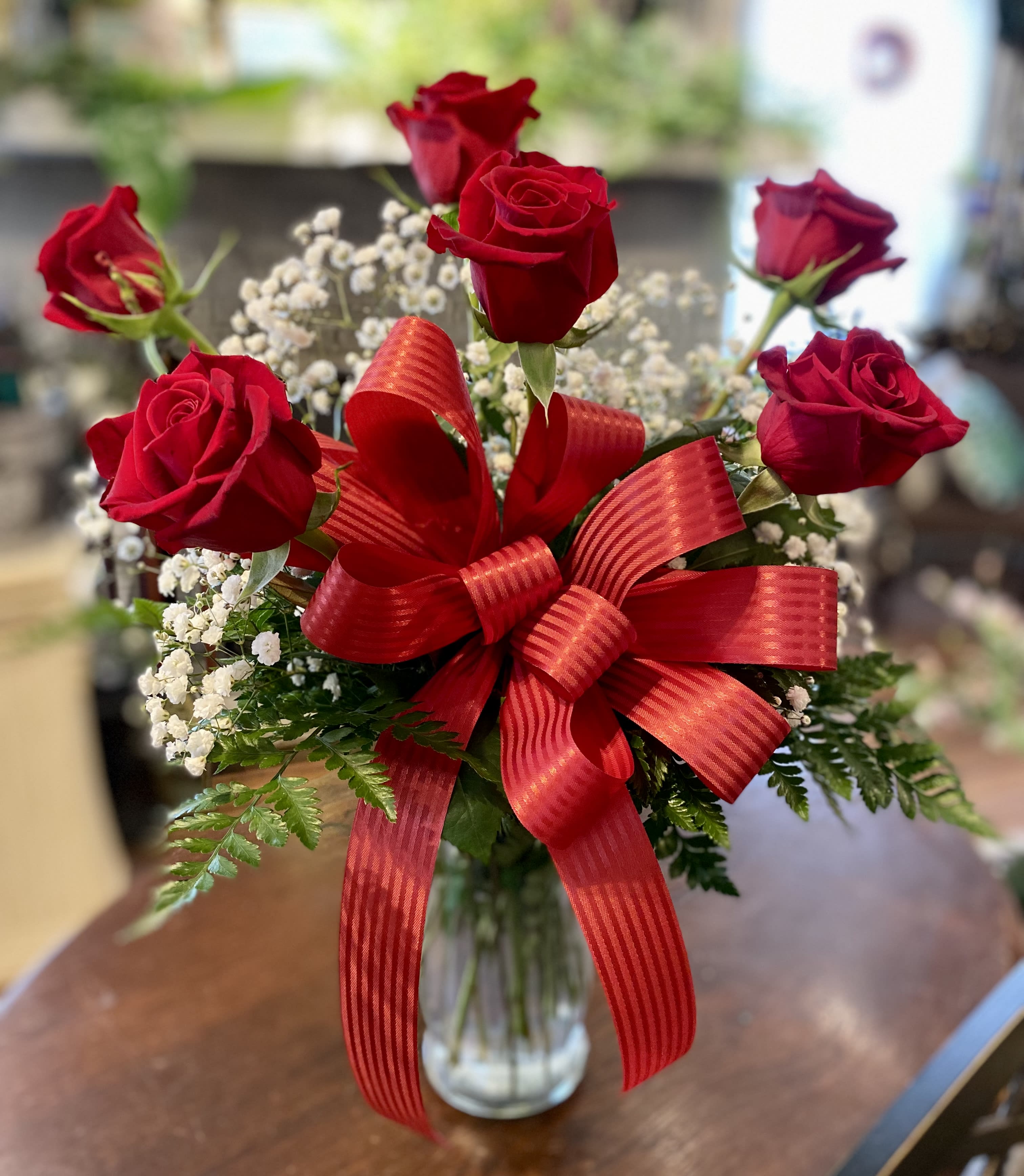 Six Long Stemmed Red Roses Arranged - Express love and caring with 6 long stemmed red roses arranged with baby’s breath! This elegant design makes a wonderful statement and is sure to be appreciated by that special someone in your life. Perfect for a spontaneous expression of affection, an anniversary, and, of course, it’s a Valentine’s Day classic! Vase and fillers may vary.