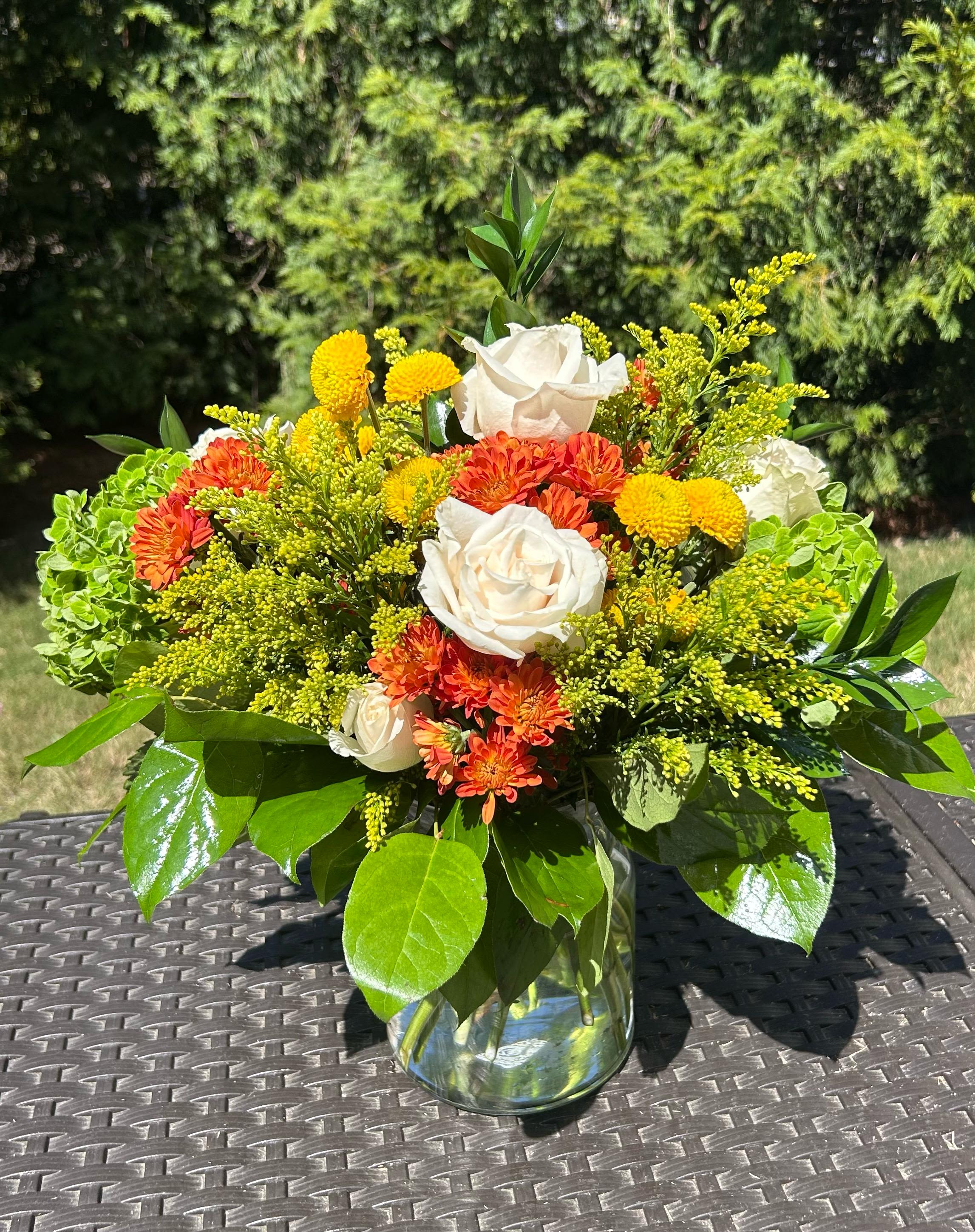  Gianna  - Light, elegant, and full of seasonal color, the Fall Foliage Bouquet is the perfect way to say “thank you,” “I love you,” or simply brighten someone’s day. Bloom Details: Ross, Hydrangea, Solidago.  Presented: Crystal Clear Glass Vessel  Place your Order Online Monday to Saturday before 1:00 p.m. (E.T.) for same-day delivery. “Orders received after hours will be delivered the next business day”. Check our coverage area.  Occasionally, flowers and/or container substitutions happen due to weather, seasonality, and market conditions, which may affect availability. If this is the case with the gift you’ve selected, we will ensure that your arrangement's style, theme, and color scheme are preserved and will only substitute items of equal value or higher value.  CARE INSTRUCTIONS Keep the flower arrangement hydrated with natural water and change the water every two days. Do not spray any cleaning product on the flower arrangement. Do not place heavy objects directly on the flower arrangement. Keep flower arrangements out of direct sunlight and extreme heat.
