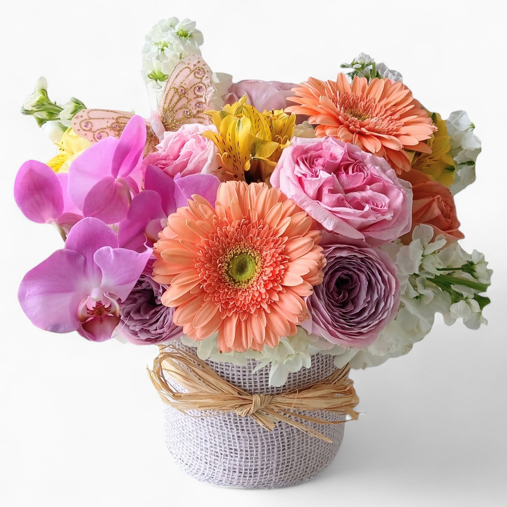 Sending A Happiness Bouquet Designer's Choice - Beautiful and filled with blush pink and white roses orchids and more arranged in a modern glass vase wrapped in pretty vanilla jute ribbon. Perfect to send today to make their day. Always made extra special and unique each time. Send happiness.