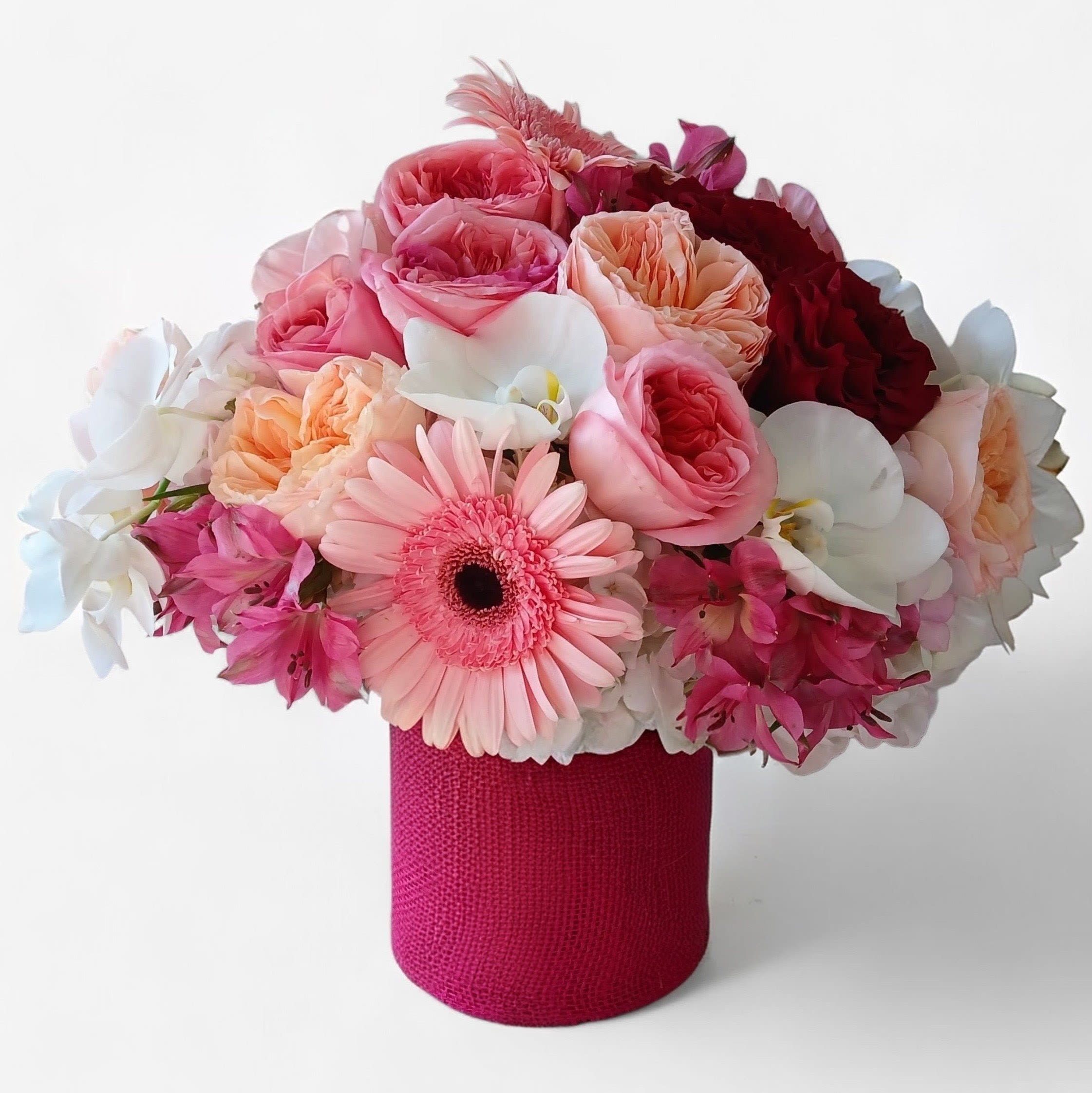 Birthday Girl Bouquet - Beautiful bouquet arranged with roses daisies hydrangeas and more in a tall modern glass vase adorned with a pretty pink satin bow. Perfect for every reason why. Send this lovely bouquet today make their day. Haddonfield flower delivery. Haddon Township flower delivery.