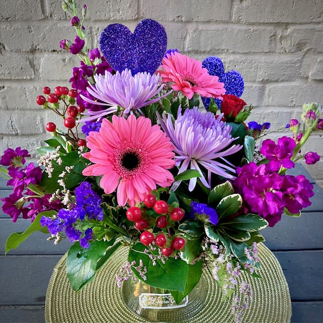 My Beloved  - Send the gift of love and passion with this beautiful and unique arrangement. Perfect for any home or office space, this stunning bouquet is the perfect way to express your love towards Your Beloved. Featuring Chrysanthemums, Roses, and Gerbera daisies with a touch of glitter in a unique heart pick, the My Beloved Valentine is sure to bring joy and show your true affection.